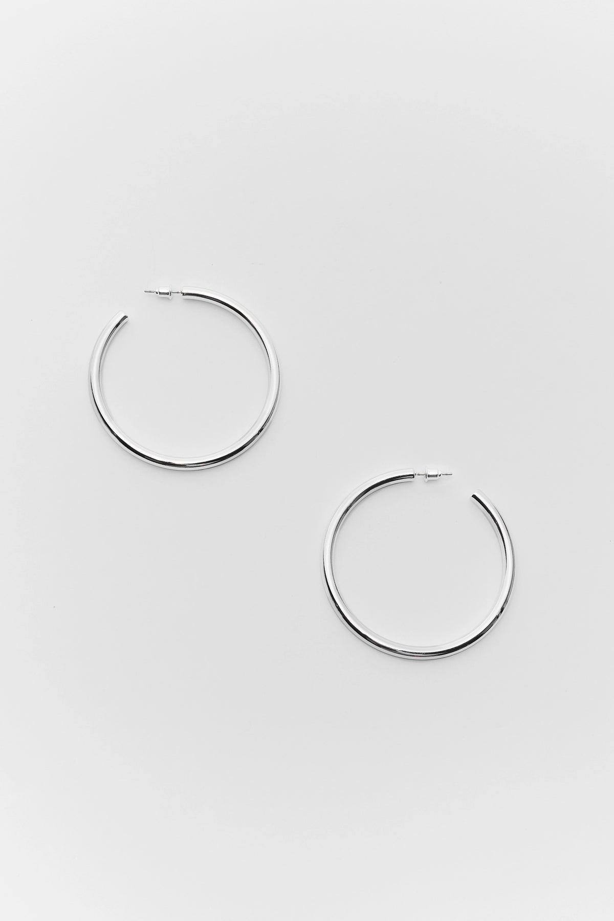 Emily Silver Medium Hoop Earrings - Flat Lay Pair | Avara