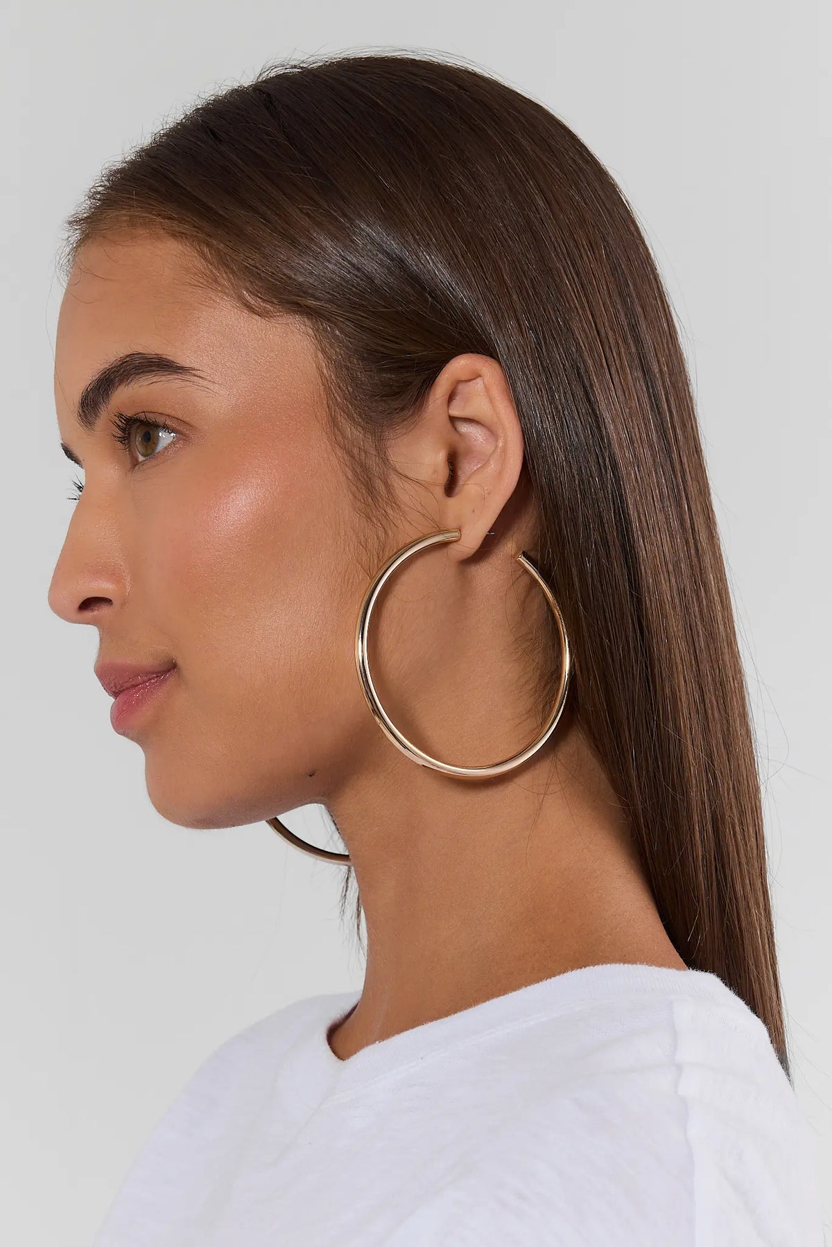 Emily Gold Large Hoop Earrings on model, side profile close-up, large gold hoops for women | Avara