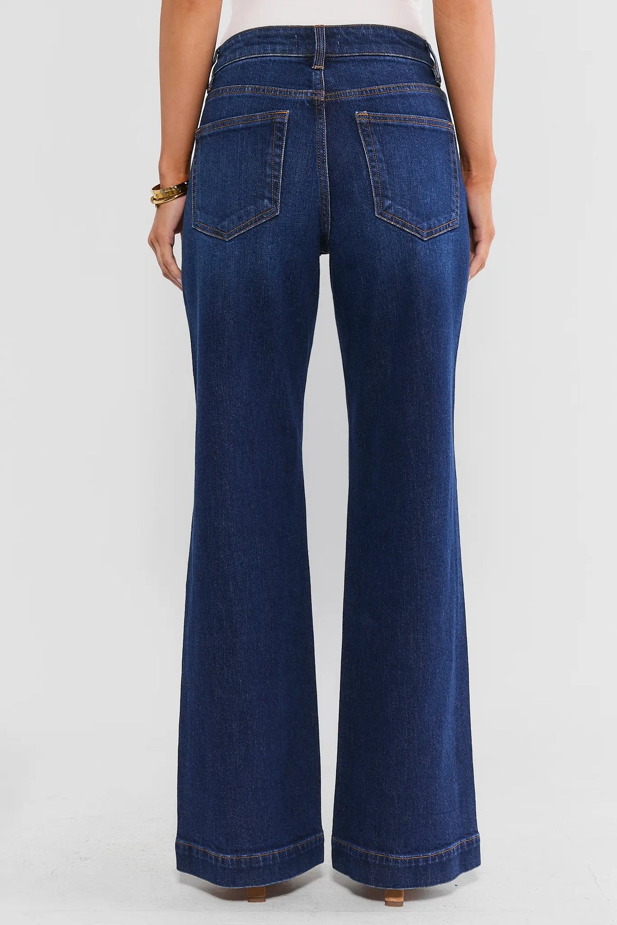 Dark Wash High-Rise Wide Leg Jeans - Back View On Model Showing Flared Wide Leg Hem | Avara