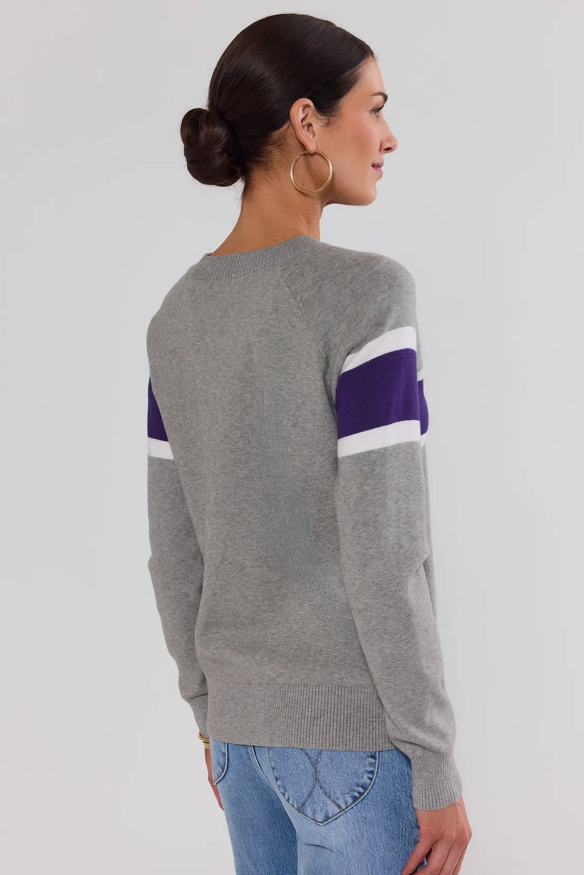 Dylan Purple Stripe Sweater back view showing purple and white varsity stripe on upper arm, heather gray knit | Avara