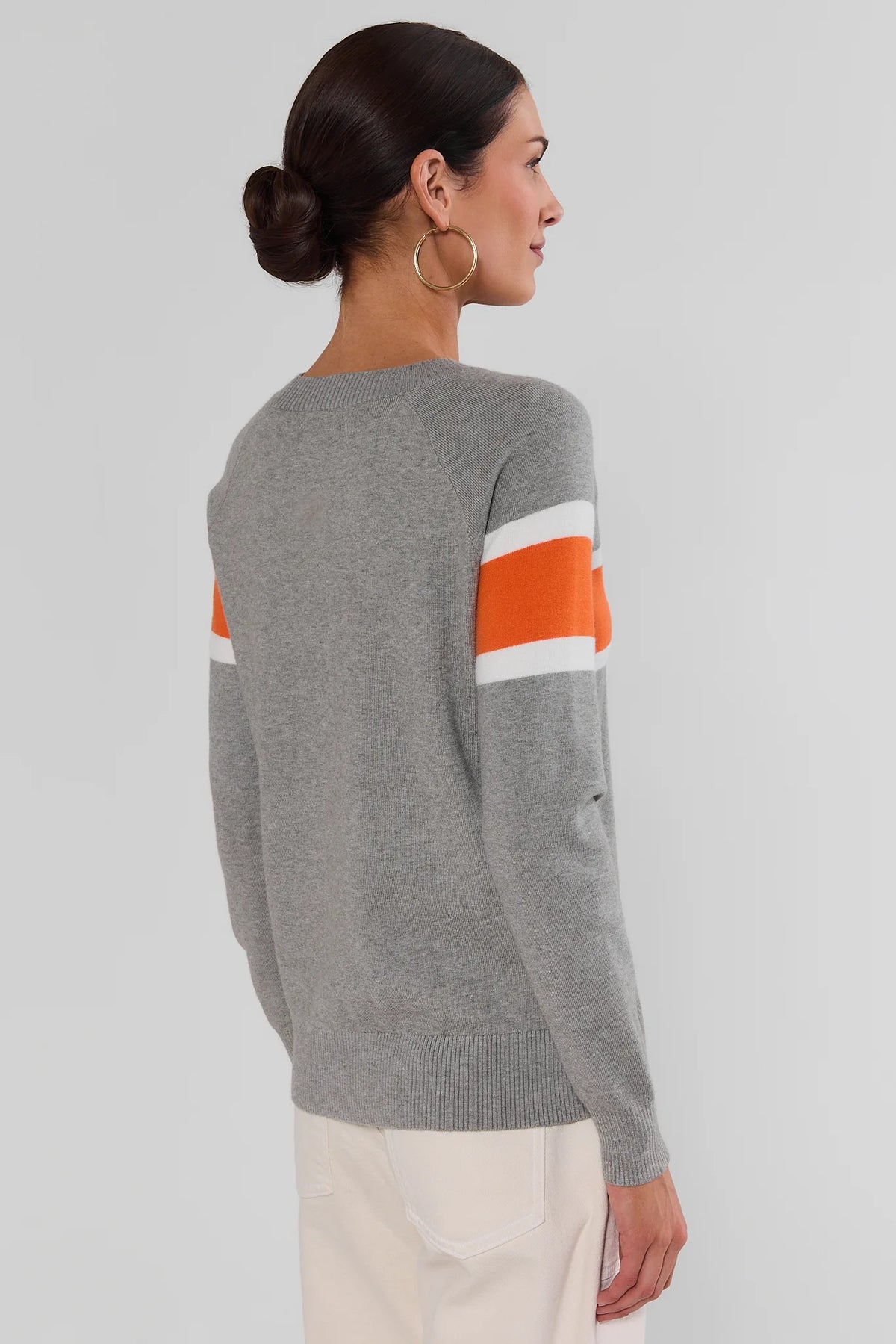 Dylan Orange Stripe Sweater showing orange and white sleeve stripes on gray knit - Back View | Avara