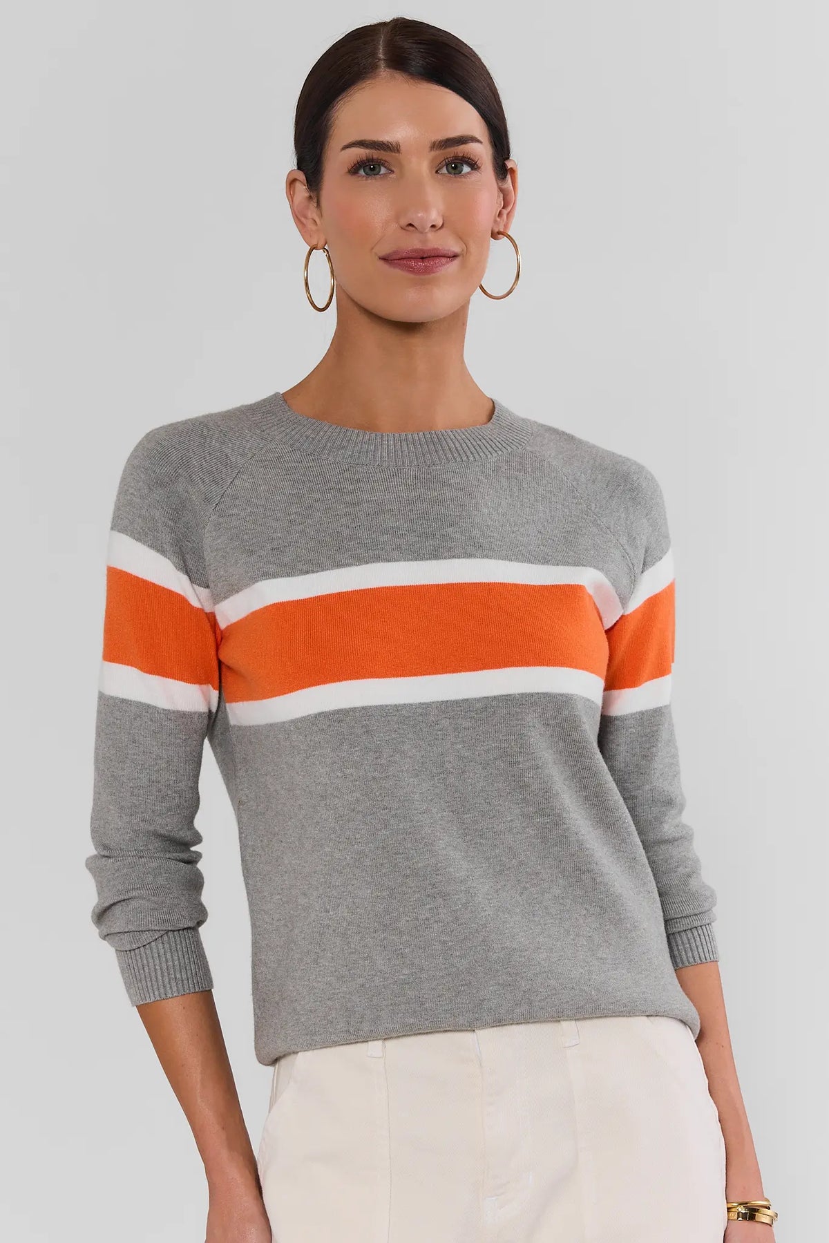 Dylan Orange Stripe Sweater in gray knit paired with cream trousers - Full Length Front View | Avara