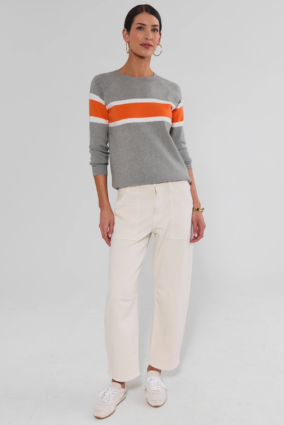 Dylan Orange Stripe Sweater gray crewneck with white sneakers - Side Angle On Model | Avara