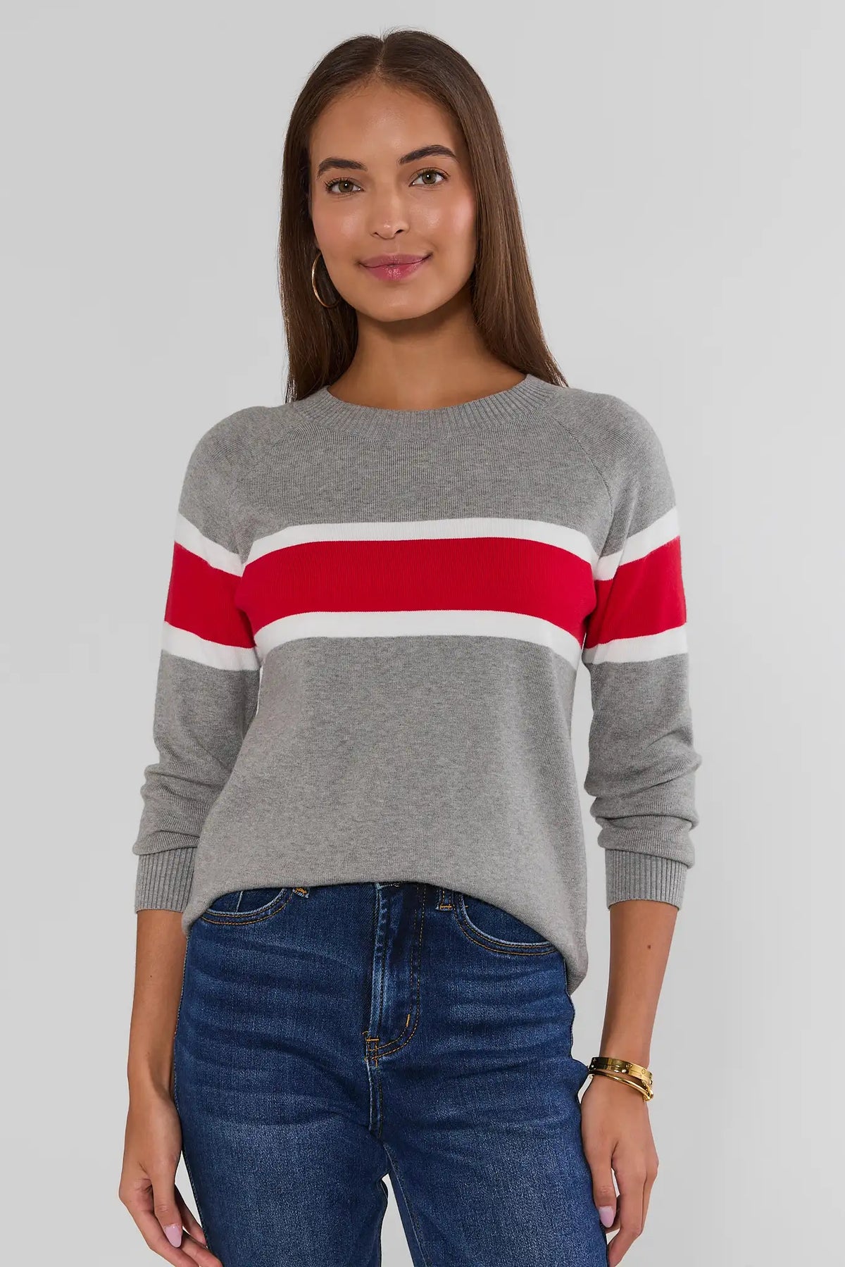 Dylan Red Stripe Sweater full-length front view, gray lightweight knit with bold red and white chest stripes, paired with dark jeans | Avara