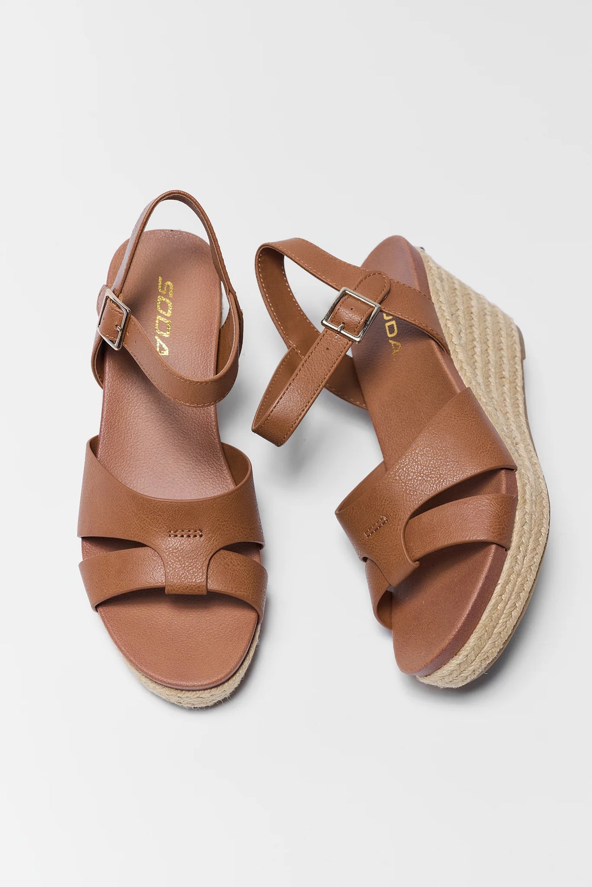 Pair of brown faux leather espadrille wedges with woven jute sole - Top View | Avara