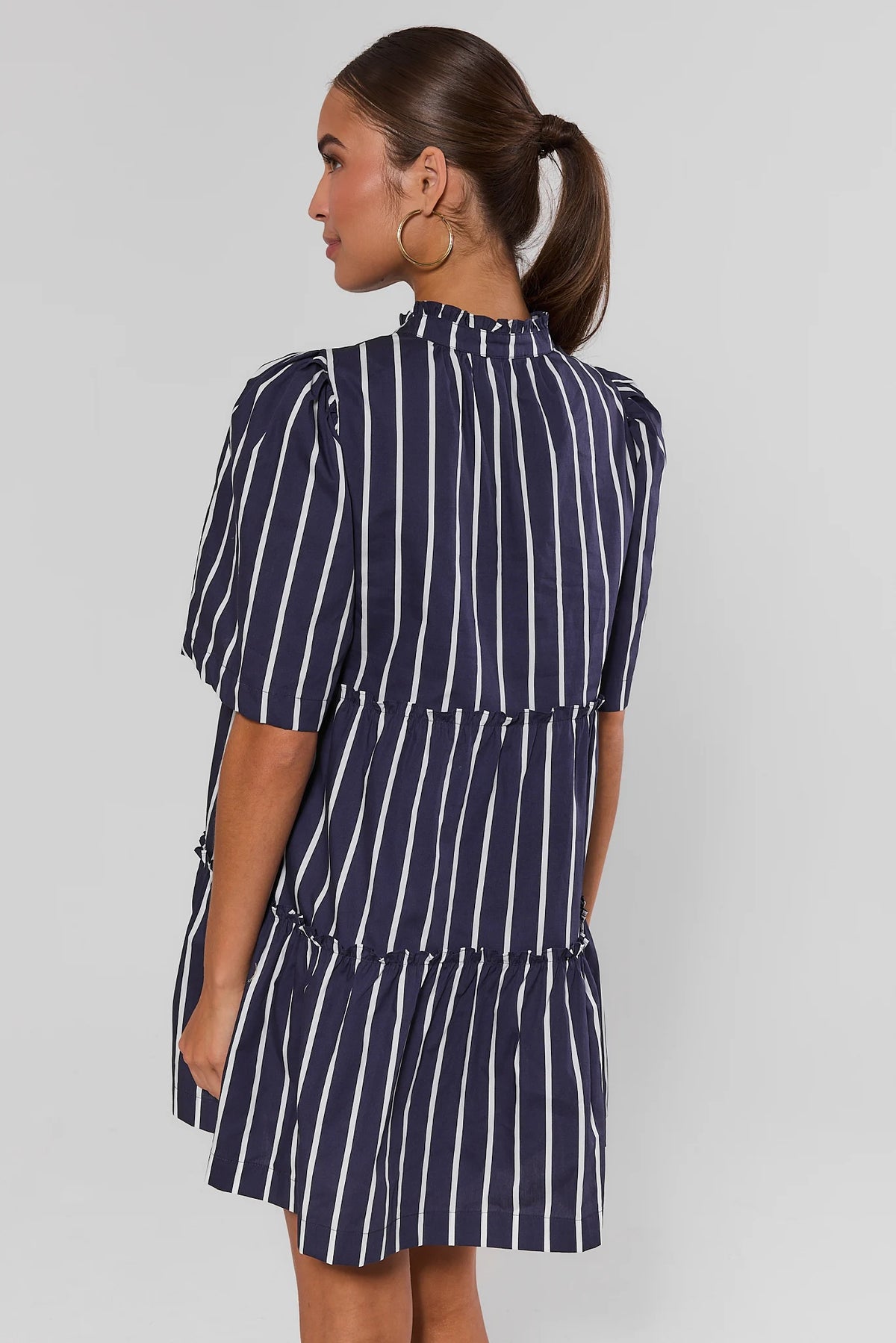 Navy and white striped tiered dress showing ruffled collar and puff sleeves - Back View | Avara