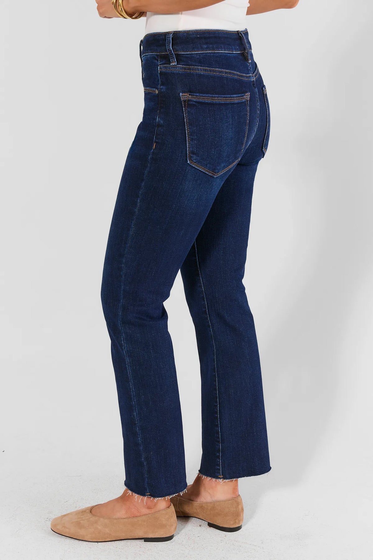 Becca Dark Wash Kick Flare Cropped Jeans - Side Profile Showing Back Pocket & Raw Hem | Avara