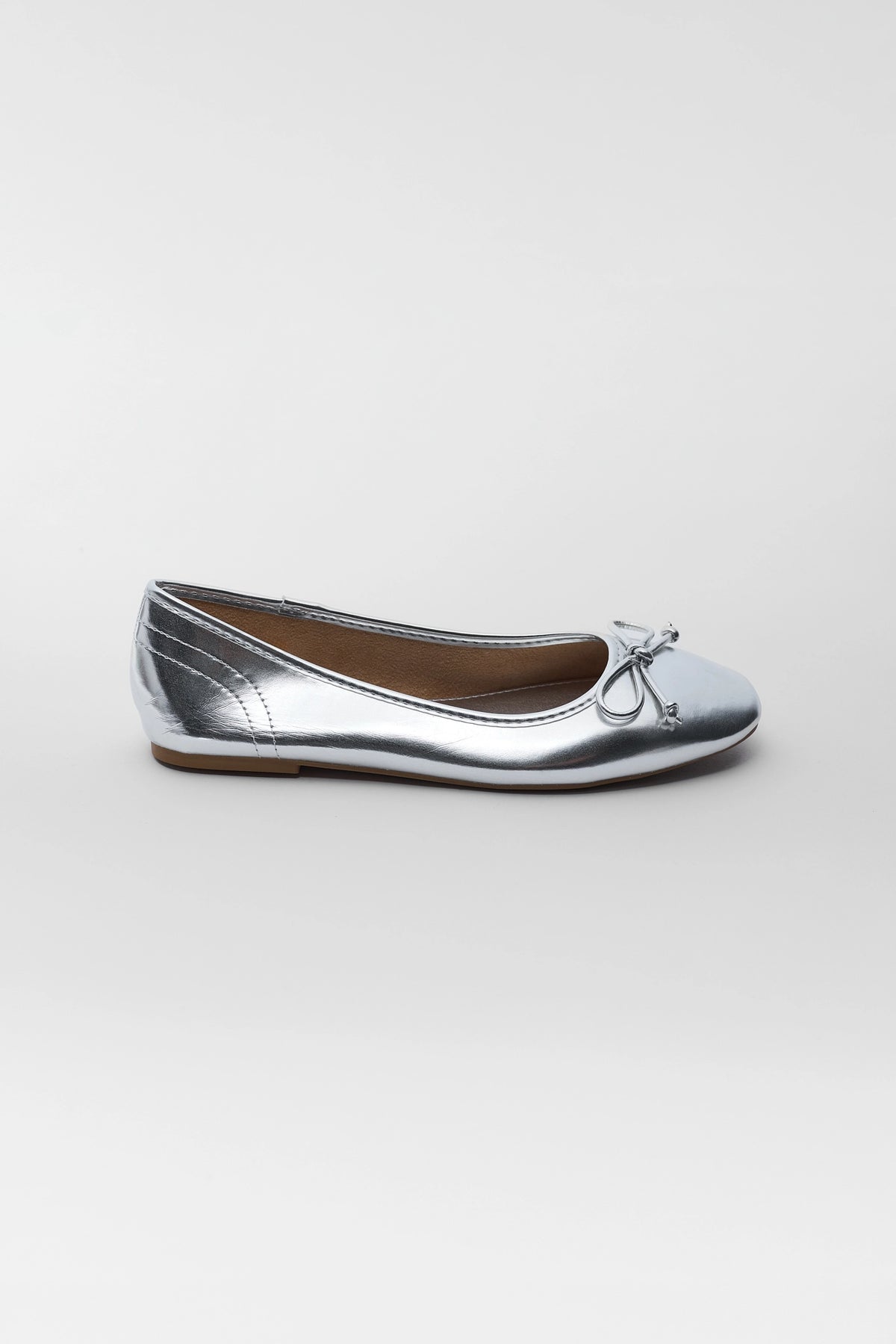 Silver bow ballet flat - Side Profile View, metallic finish, classic slip-on silhouette and bow detail | Avara