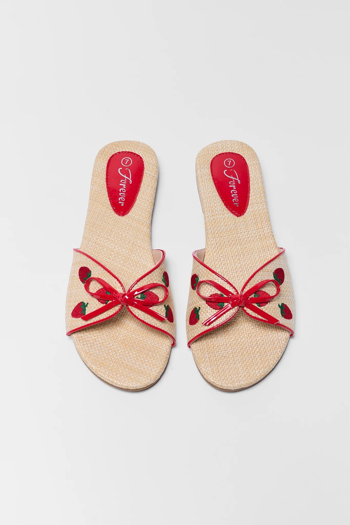Two Tan Raffia Strawberry Sandals with red patent bow and strawberry embroidery - Angled View | Avara