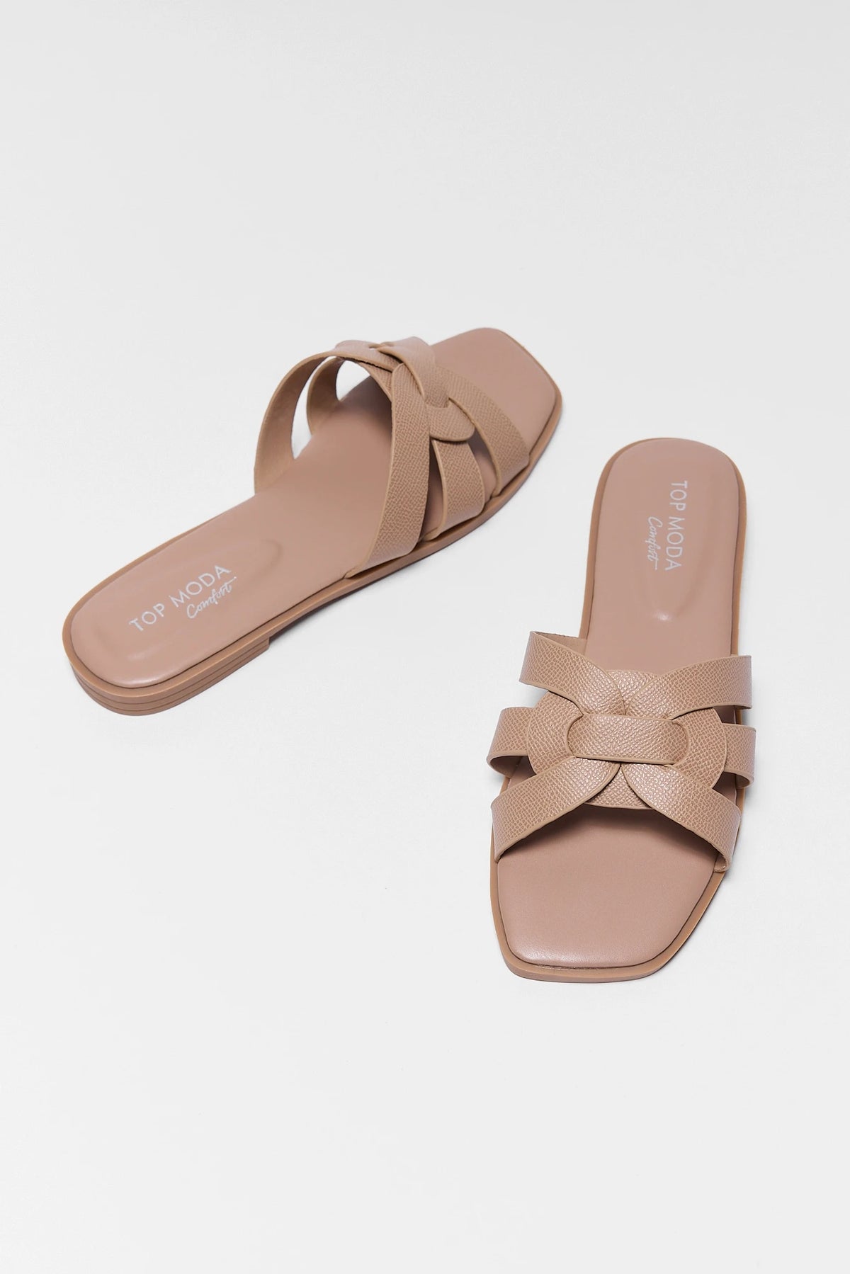 Two tan slip on sandals with woven faux leather straps and square toe - Angled Pair View | Avara