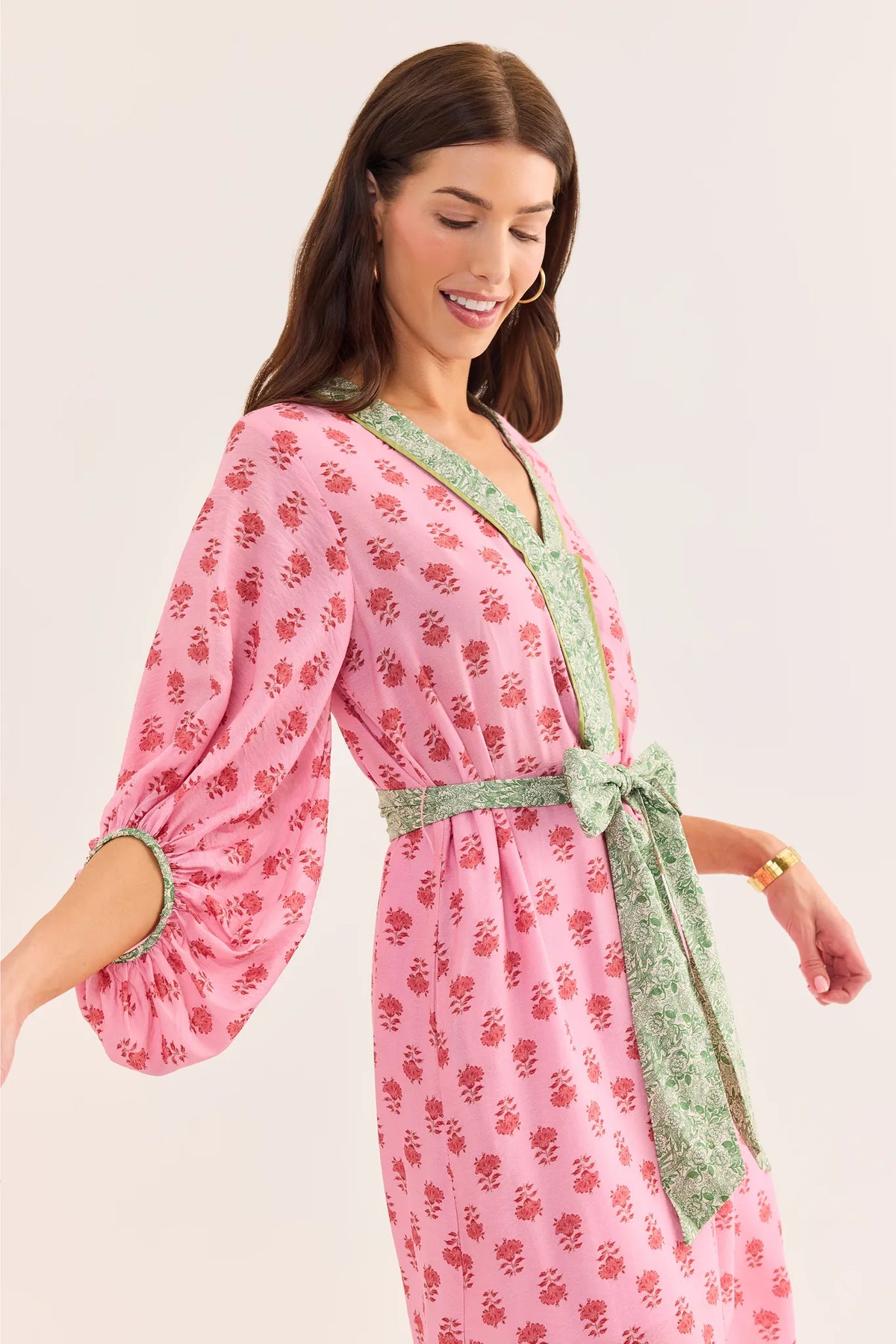 Tessa Pink Floral Midi Dress - Side Detail, Green Contrast Tie Waist and Balloon Sleeve on Model | Avara