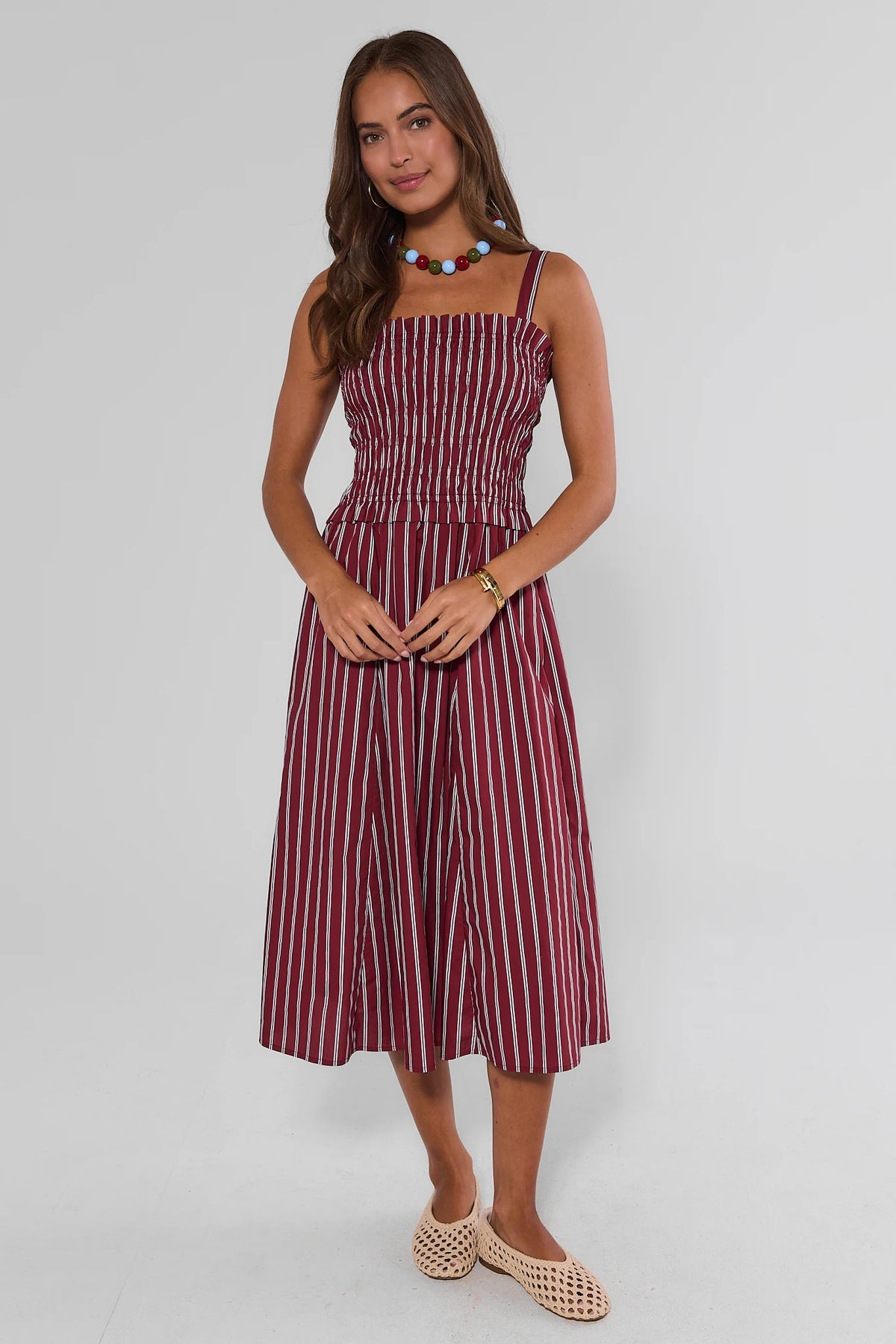 Maroon and white striped smocked midi dress with square neckline and wide straps - Front View | Avara