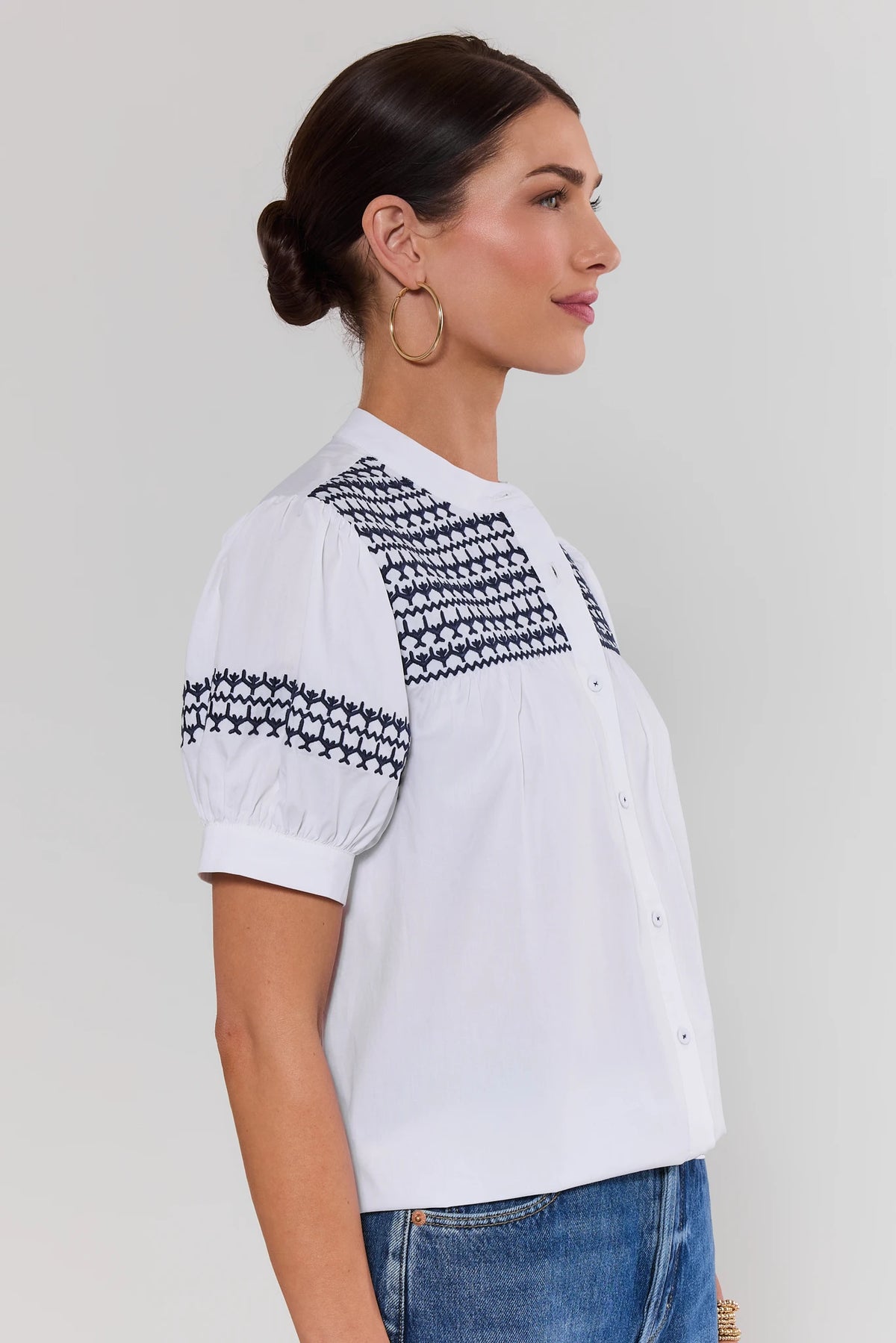 Trudy White Navy Embroidered Top - Side Profile showing navy embroidered sleeve band detail | Avara