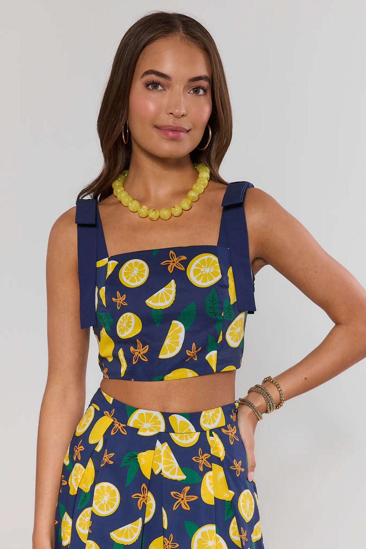 Navy lemon print tank top with bow tie straps, square neckline, cropped fit - Front View On Model | Avara