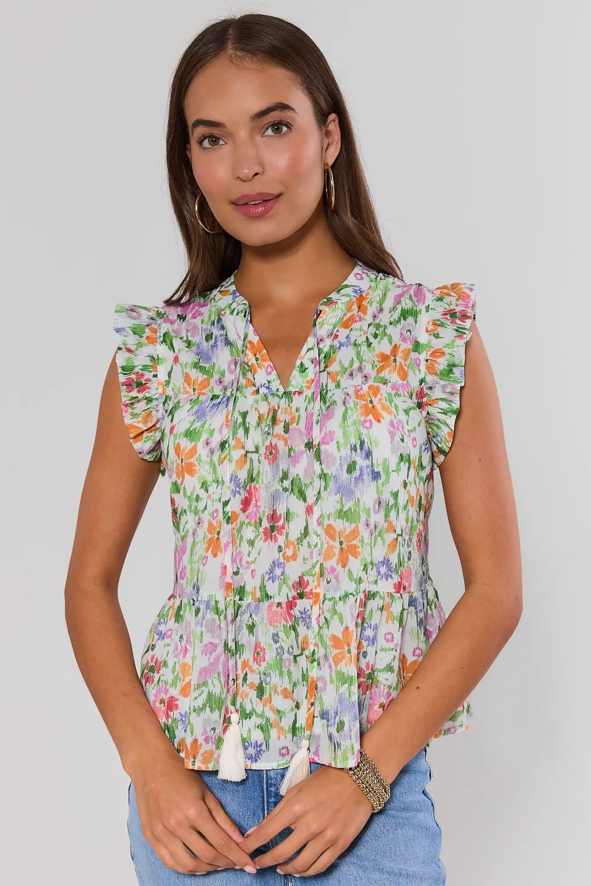 Multi floral Faye Flutter Sleeve Top - Front View, V-neck with tassel ties on model | Avara