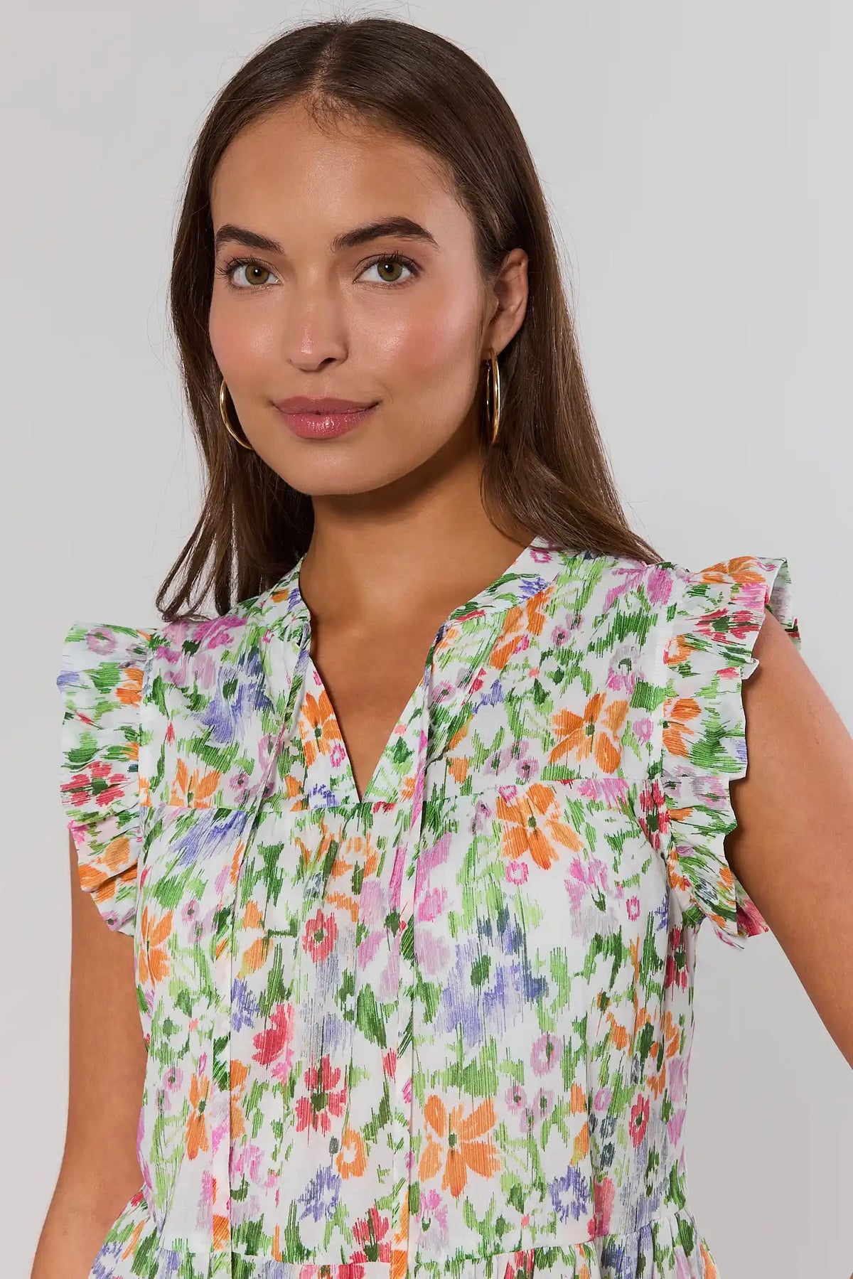 Close-up of colorful floral Faye Flutter Sleeve Top - ruffle sleeve and V-neckline detail | Avara