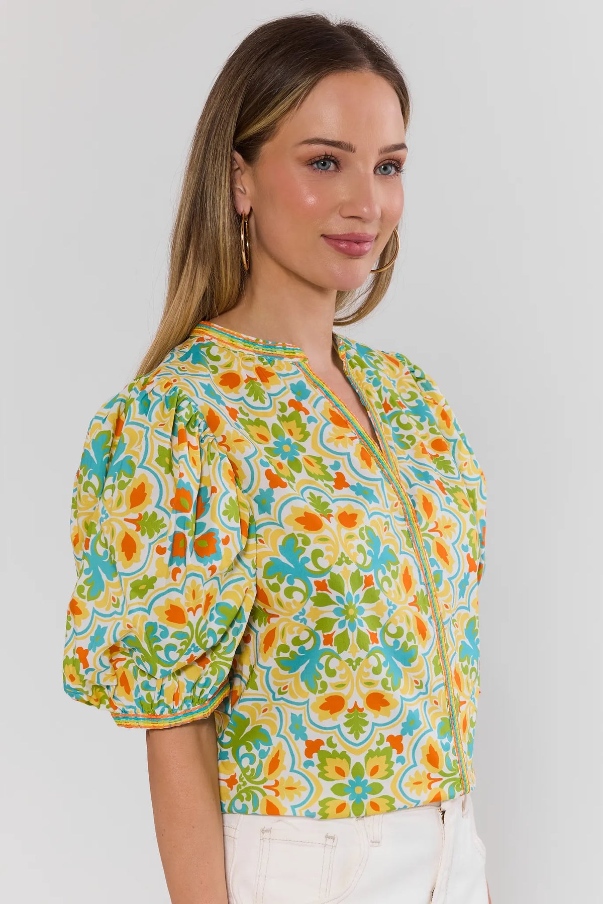 Allister Multi Printed Split Neck Top - abstract print puff sleeve top, side view on model | Avara