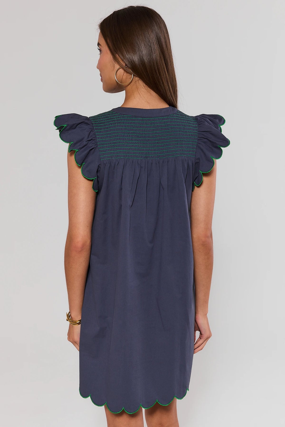 Navy flutter sleeve short dress with green scalloped hem and smocked back yoke - Back View | Avara