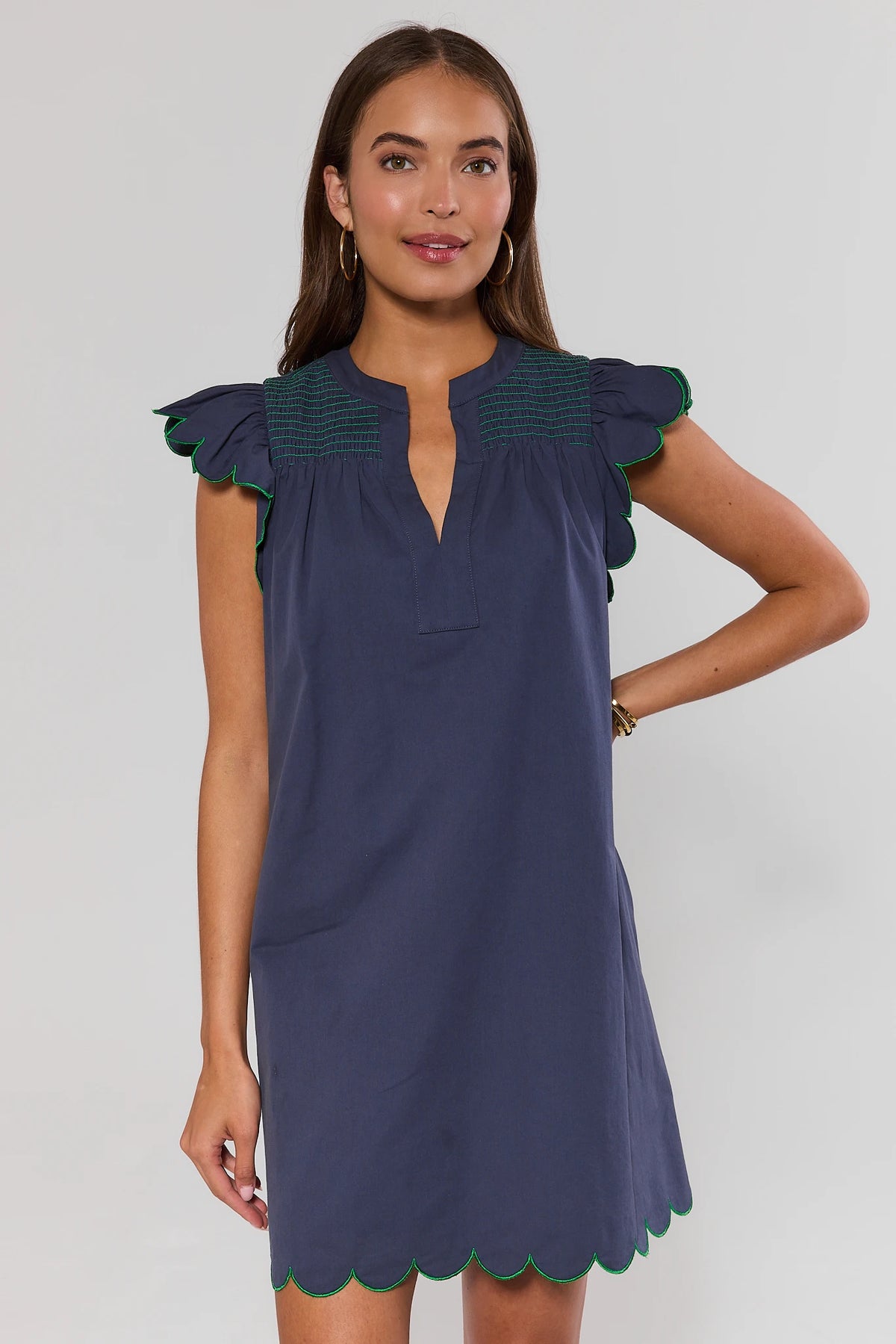 Navy flutter sleeve short dress with green scalloped trim and smocked yoke - Front View | Avara