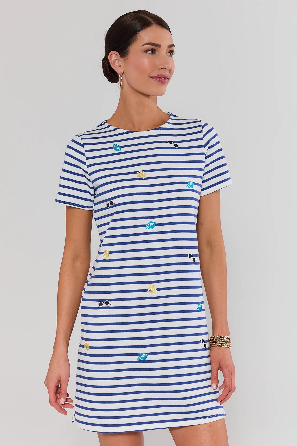 Blue Stripe Embroidered Shirt Dress with seashell icons, front three-quarter view on model | Avara