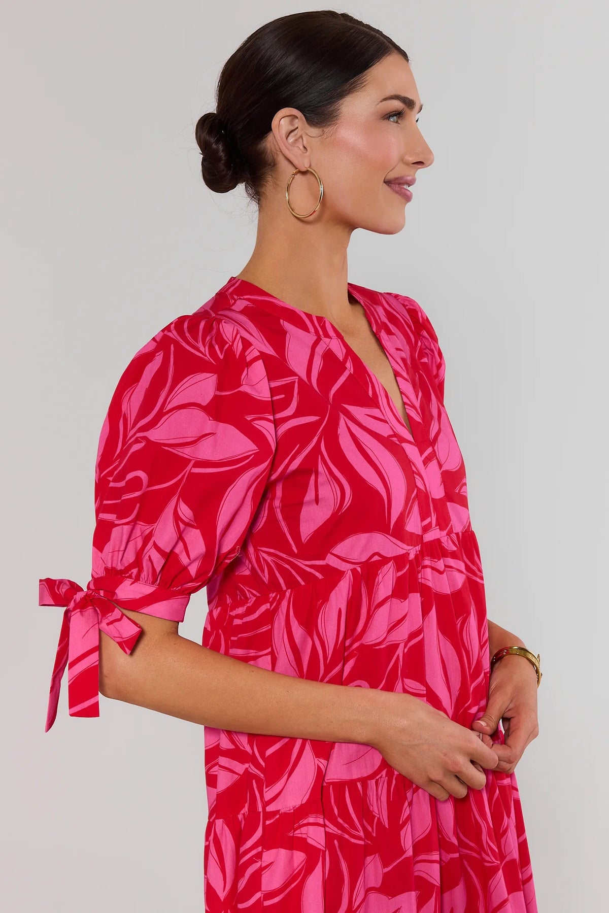 Harriet Red Printed Midi Dress - Close-Up of V-Neckline and Tied Sleeve | Avara