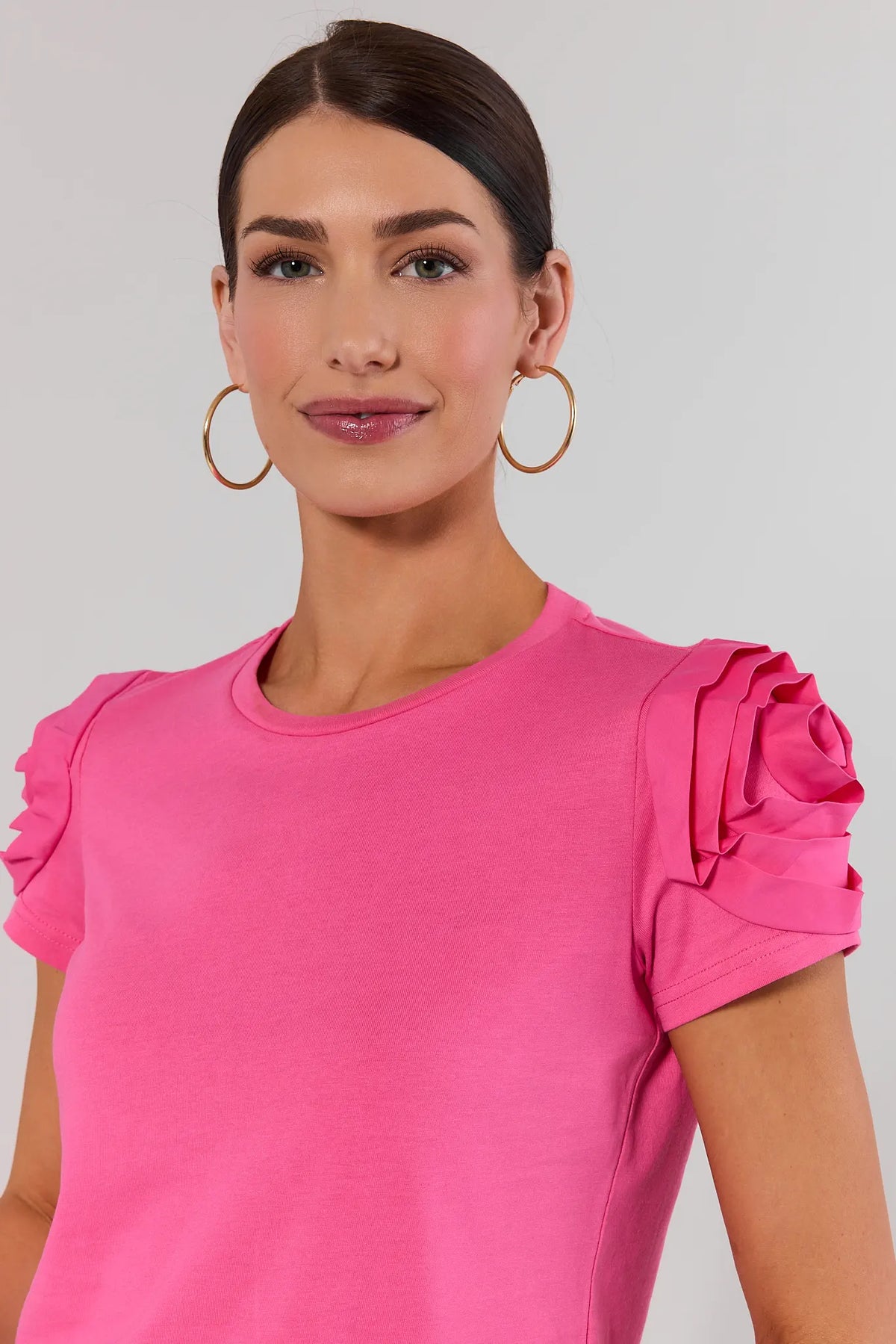 Close-up of pink floral appliqué rosette sleeve detail on Kendall Top - Cute Top for Women | Avara