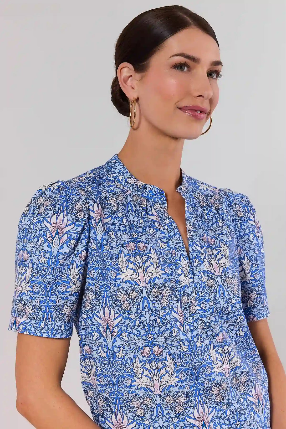 Blue Printed Split Neck Top split neckline and floral print close-up detail, on model | Avara