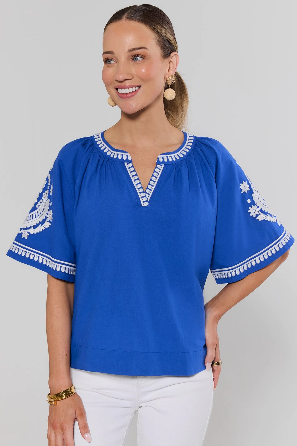 Essie Blue Embroidered Top - Royal Blue Flutter Sleeve with White Embroidery, Front View On Model | Avara
