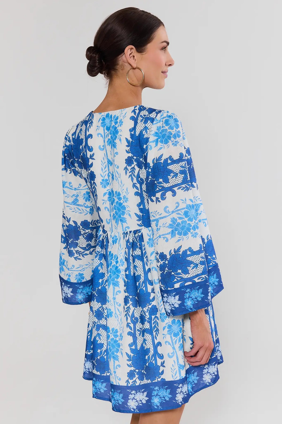 Blue Mixed Floral Print Short Dress back view showing relaxed silhouette and border hem | Avara