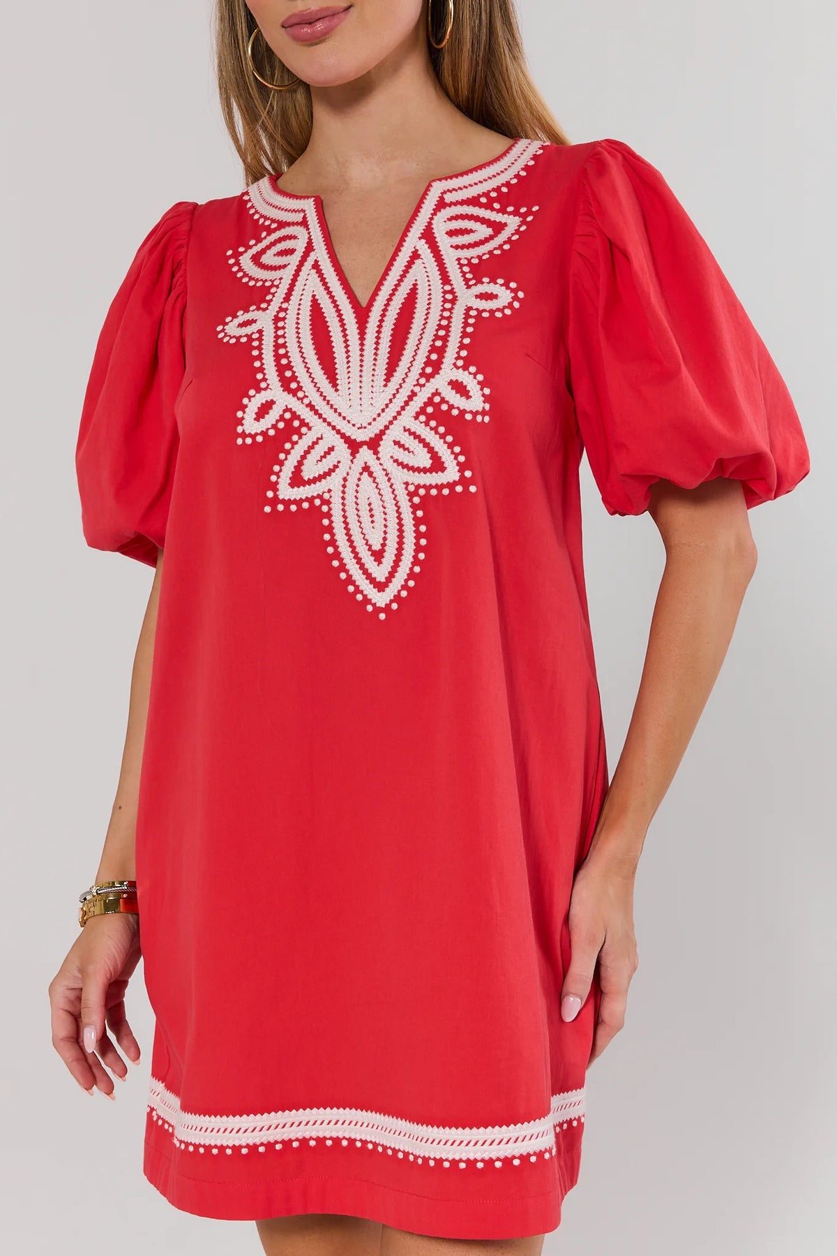 Roxanne Red Embroidered Short Dress close-up of white embroidery neckline and puff sleeves | Avara
