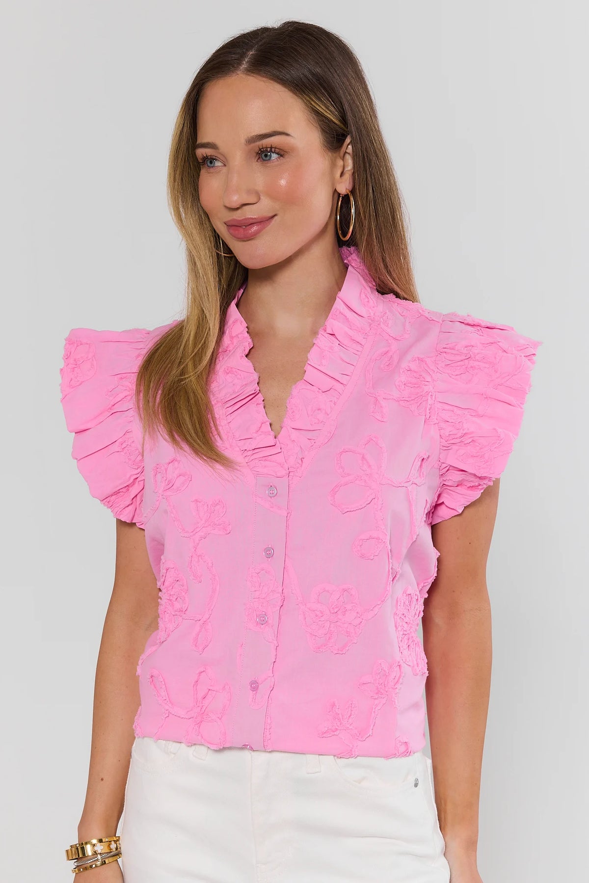 Sandra Light Pink Textured Floral Top with ruffle sleeves and V-neck, front view on model | Avara