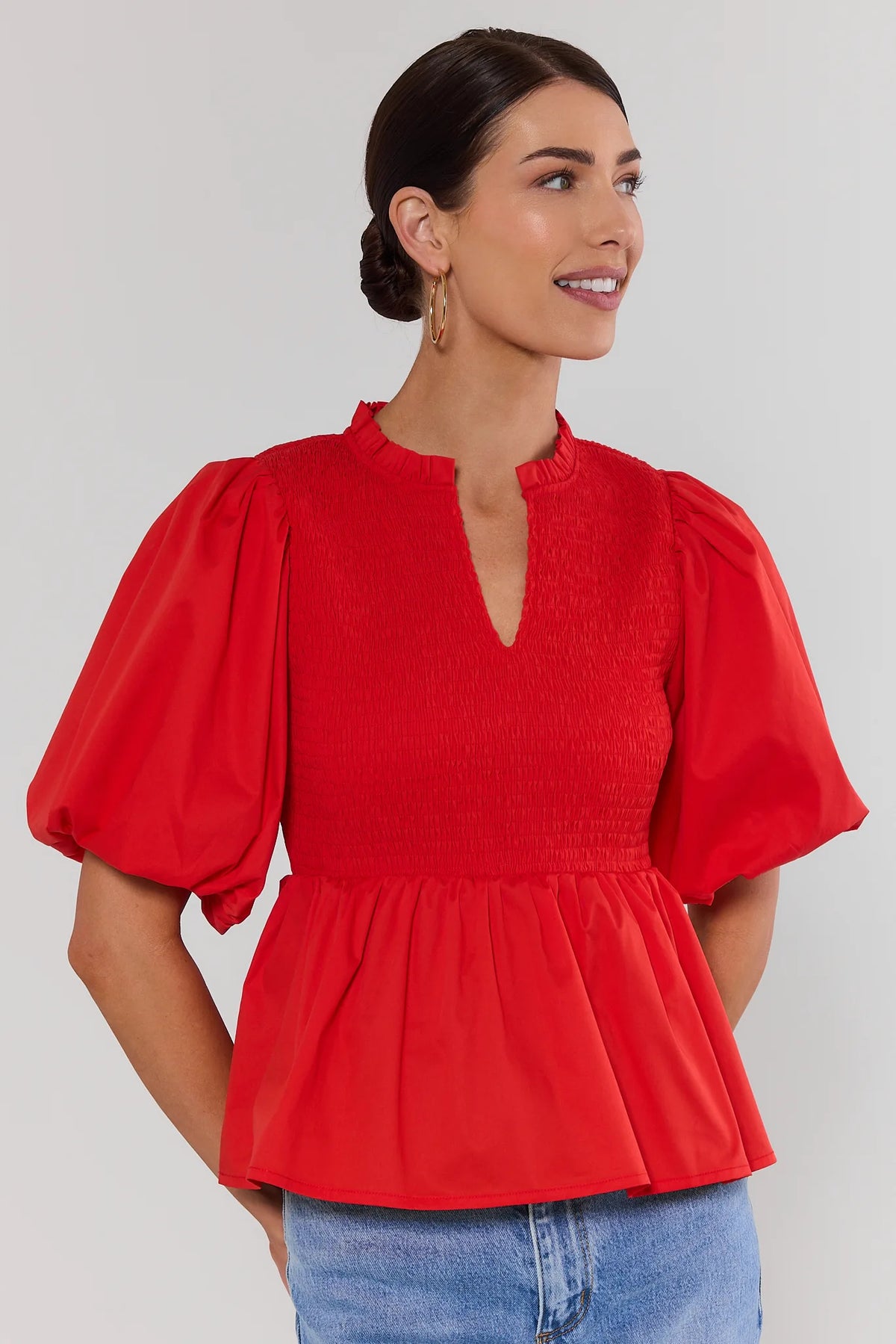 Red Smocked Peplum Top with puff sleeves and ruffle band collar - Front View | Avara