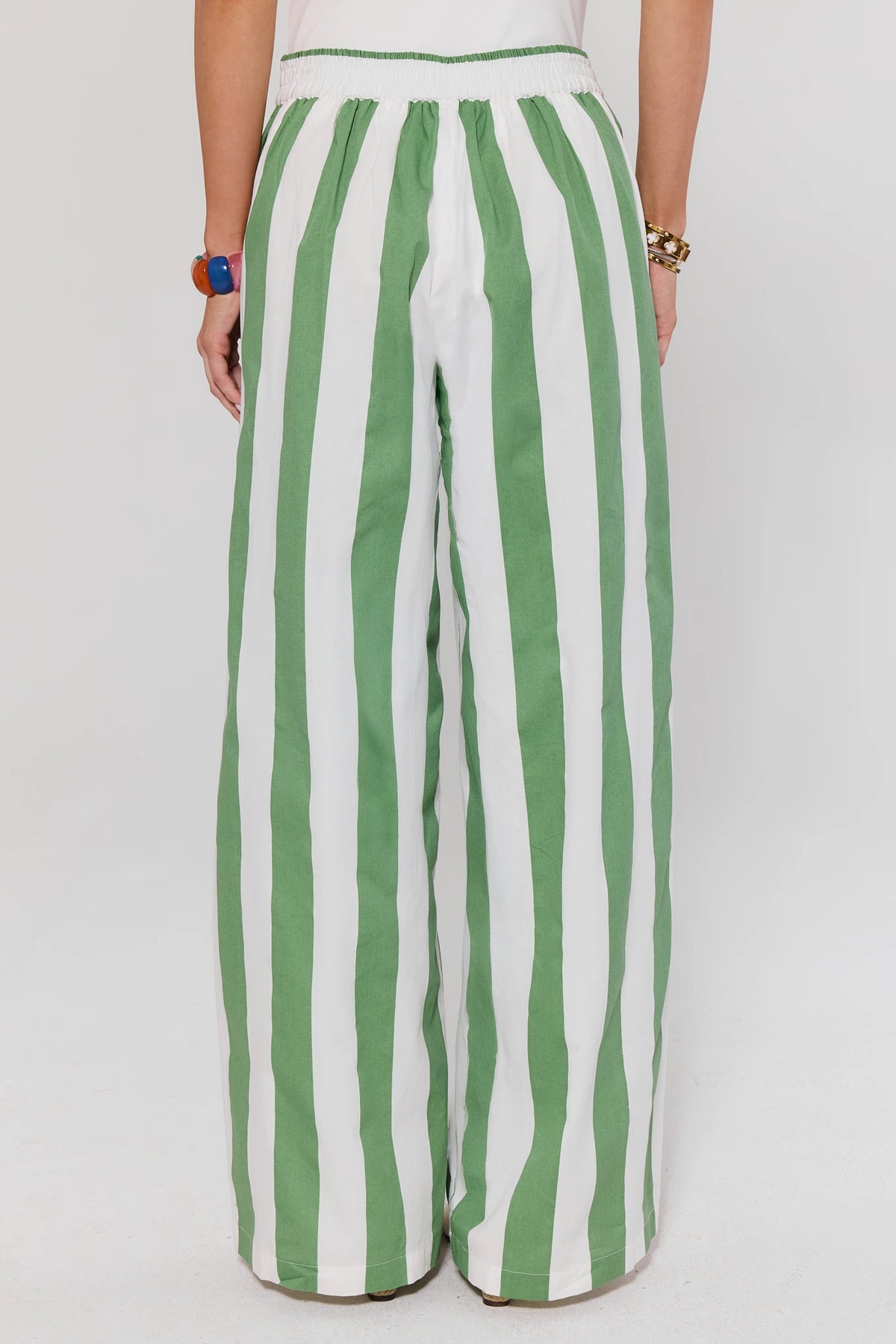 Green and white striped wide leg pants back view showing elastic waist detail on model | Avara