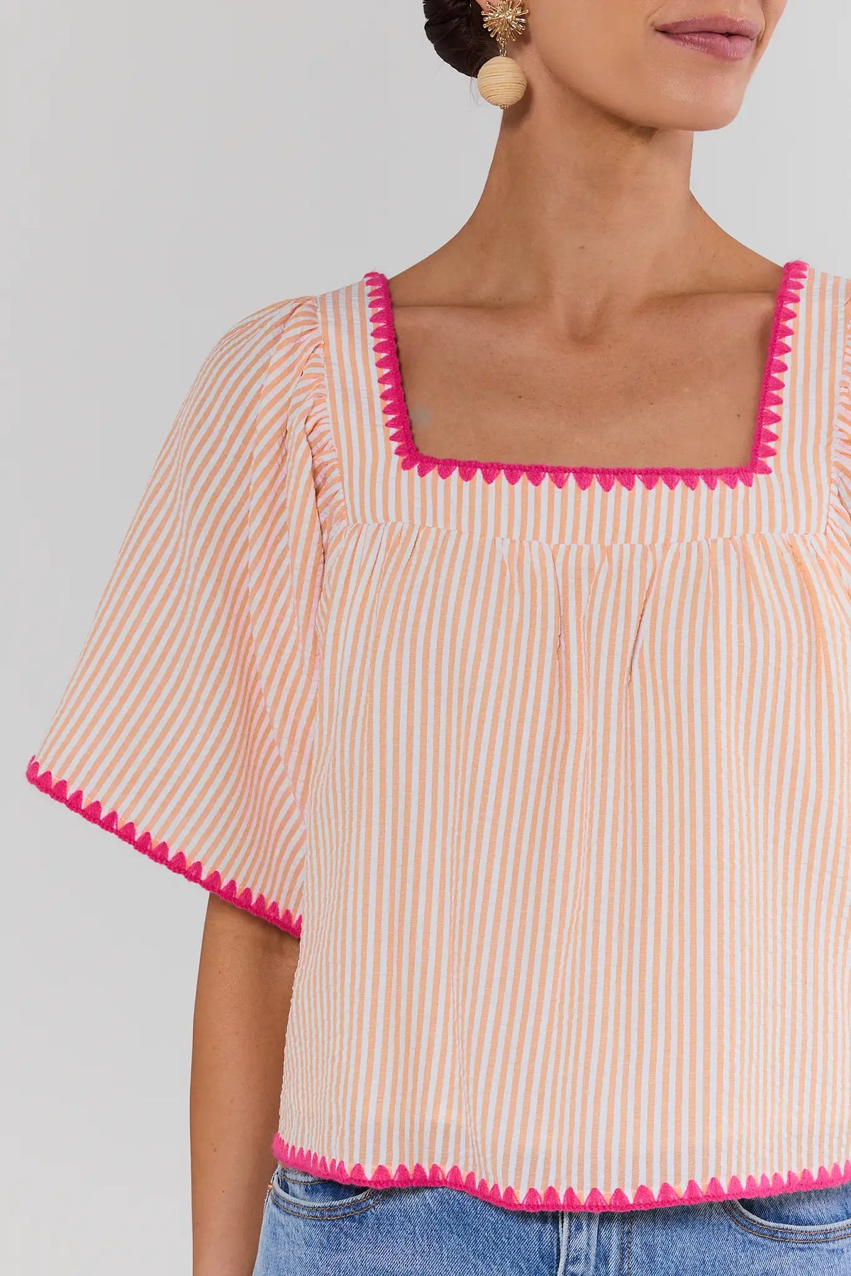 Orange striped square neck top with pink stitched trim detail - Close-Up Front | Avara