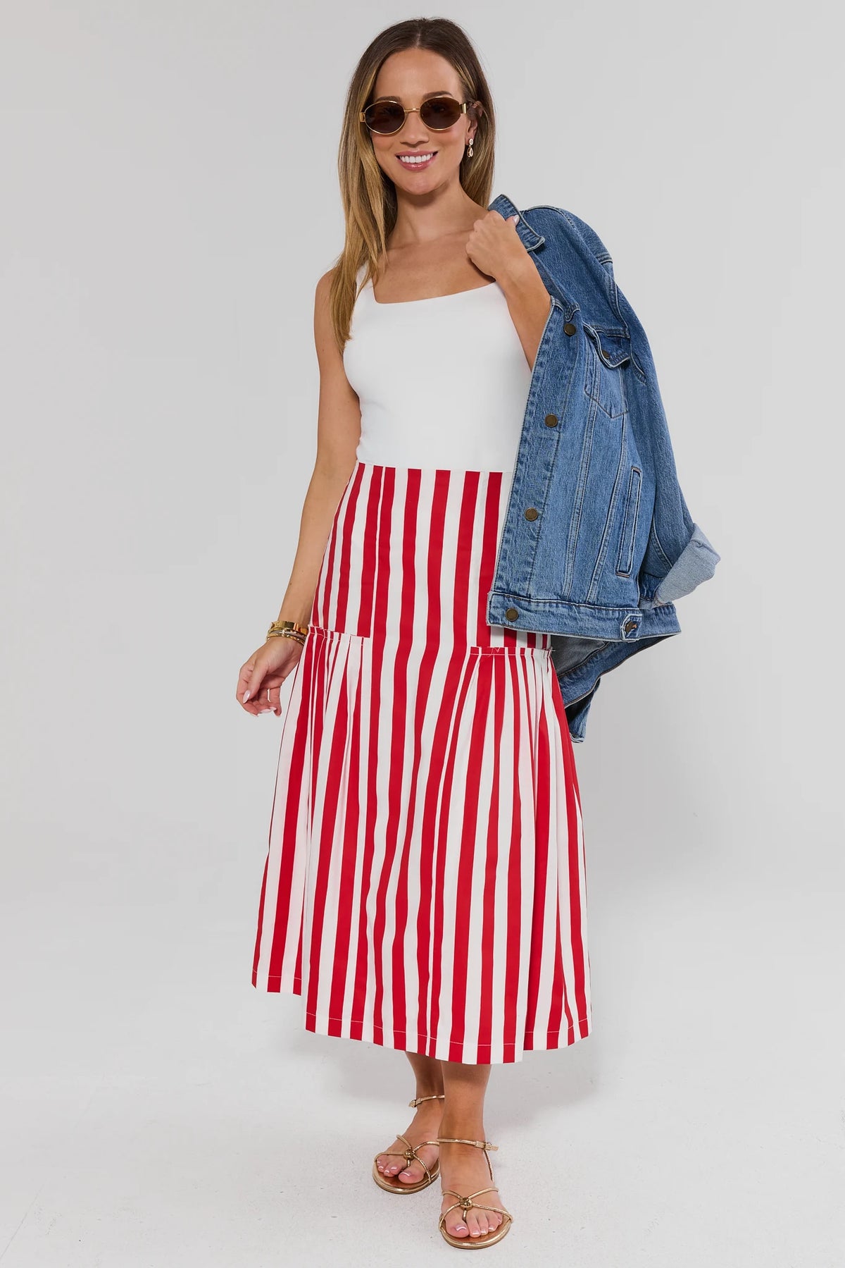 Red striped midi skirt styled with white tank and denim jacket - Full Length On Model | Avara