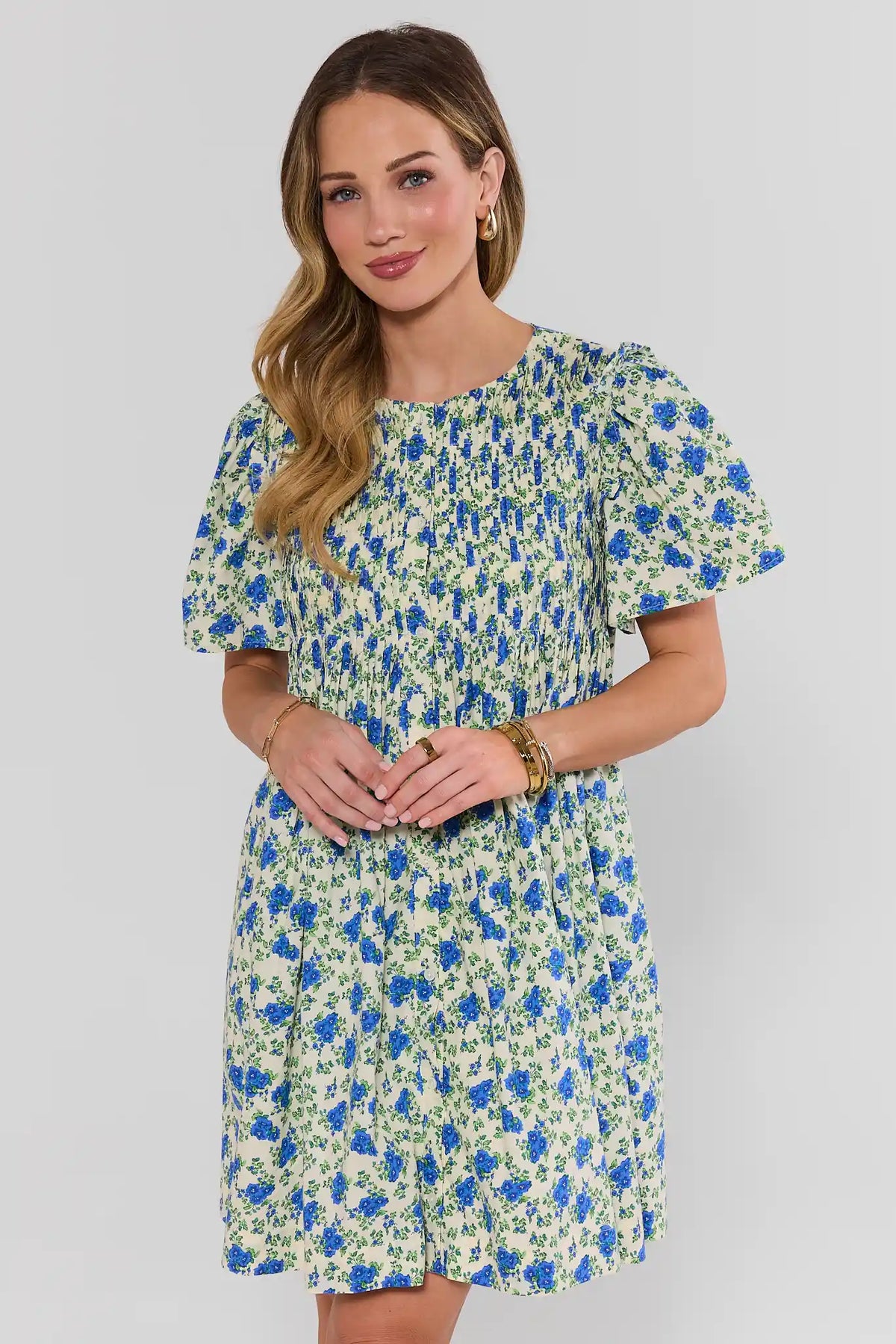 Blue Floral Pleated Short Dress, front view on model, puff sleeves and smocked bodice | Avara