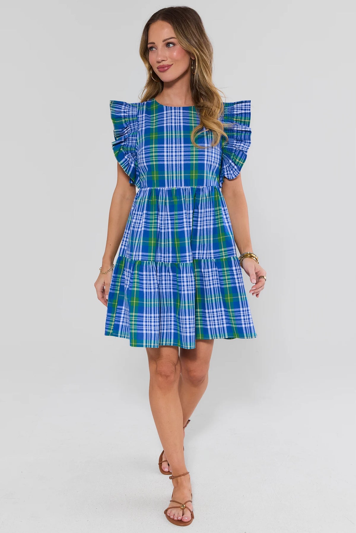 Women's blue plaid short dress full-length front view with tiered skirt and flutter sleeves | Avara