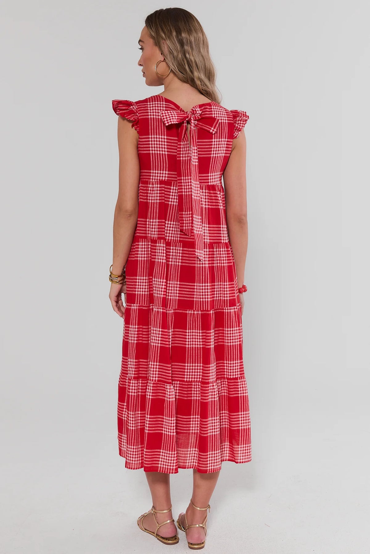 Red plaid midi dress back view with bow tie closure and flutter sleeves | Avara