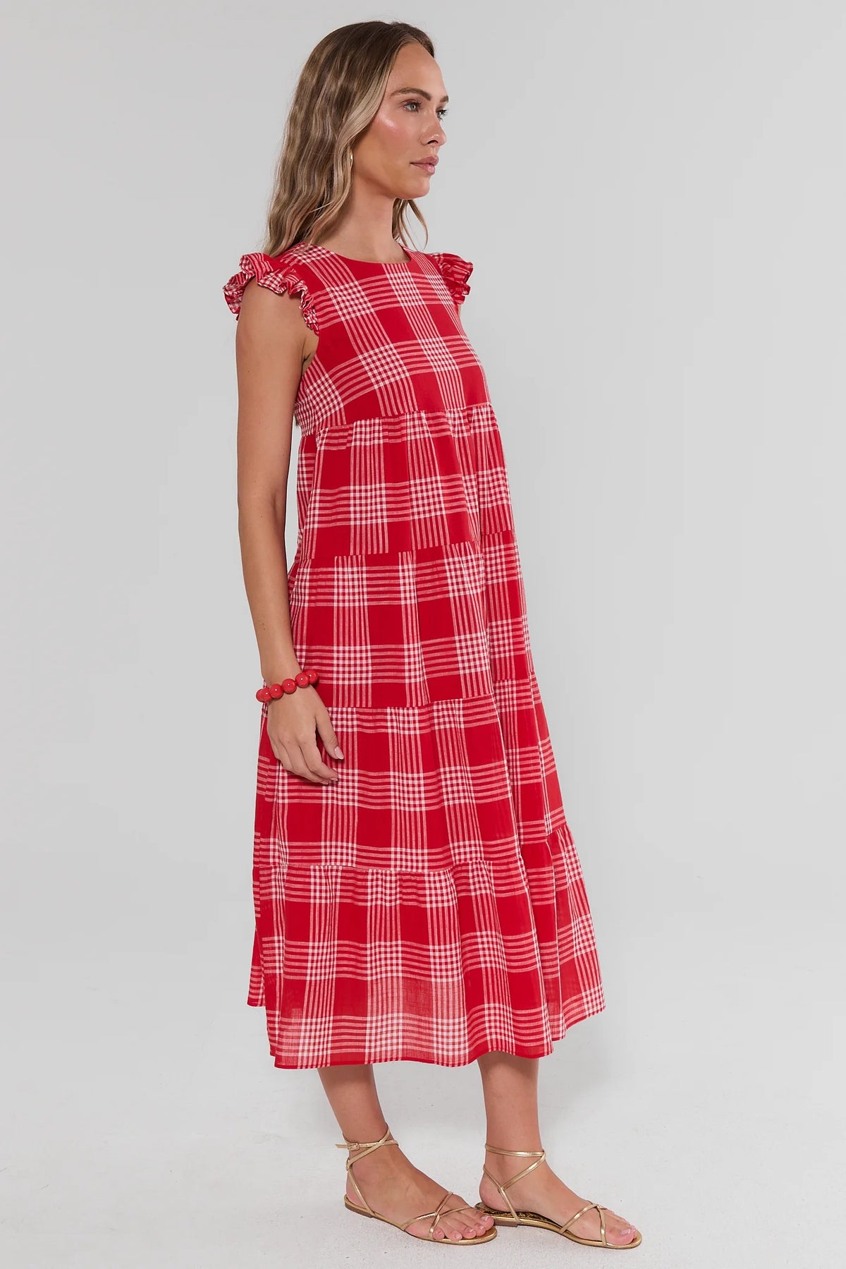 Red Plaid Flutter Sleeve Midi Dress, side profile showing tiered skirt and flutter sleeves | Avara