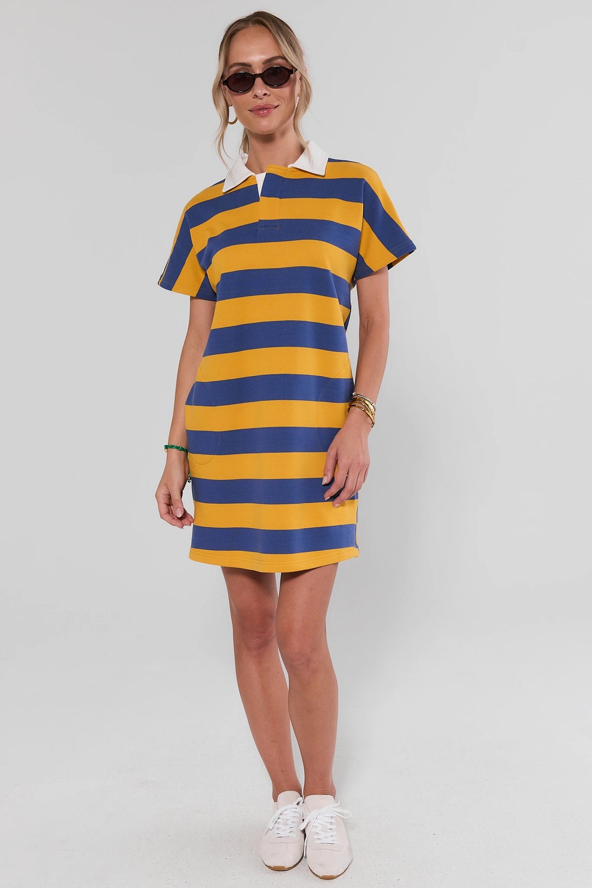 Navy & Yellow Striped Polo Dress styled with white sneakers and sunglasses - Full Length | Avara