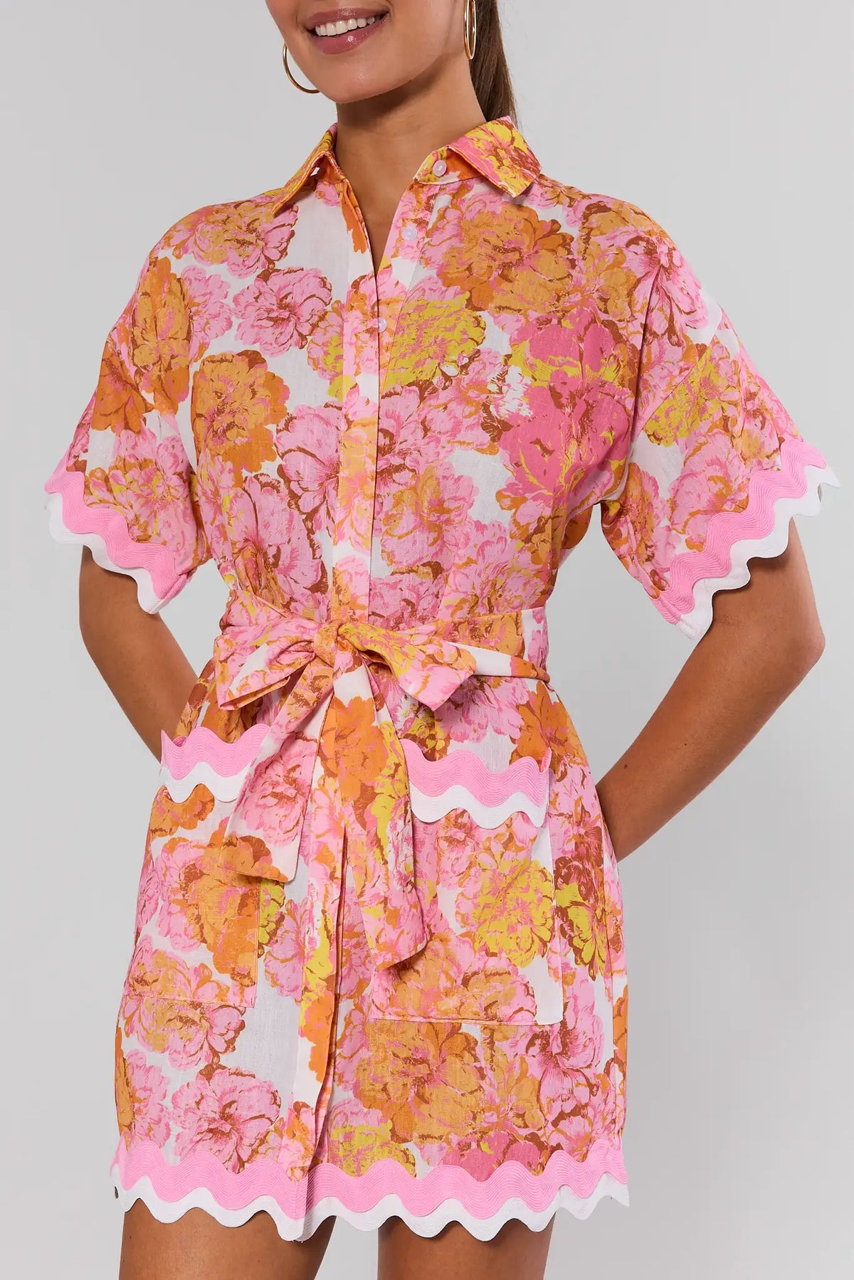 Pink orange floral short dress with ric rac hem trim and tie waist - Close-Up Detail | Avara