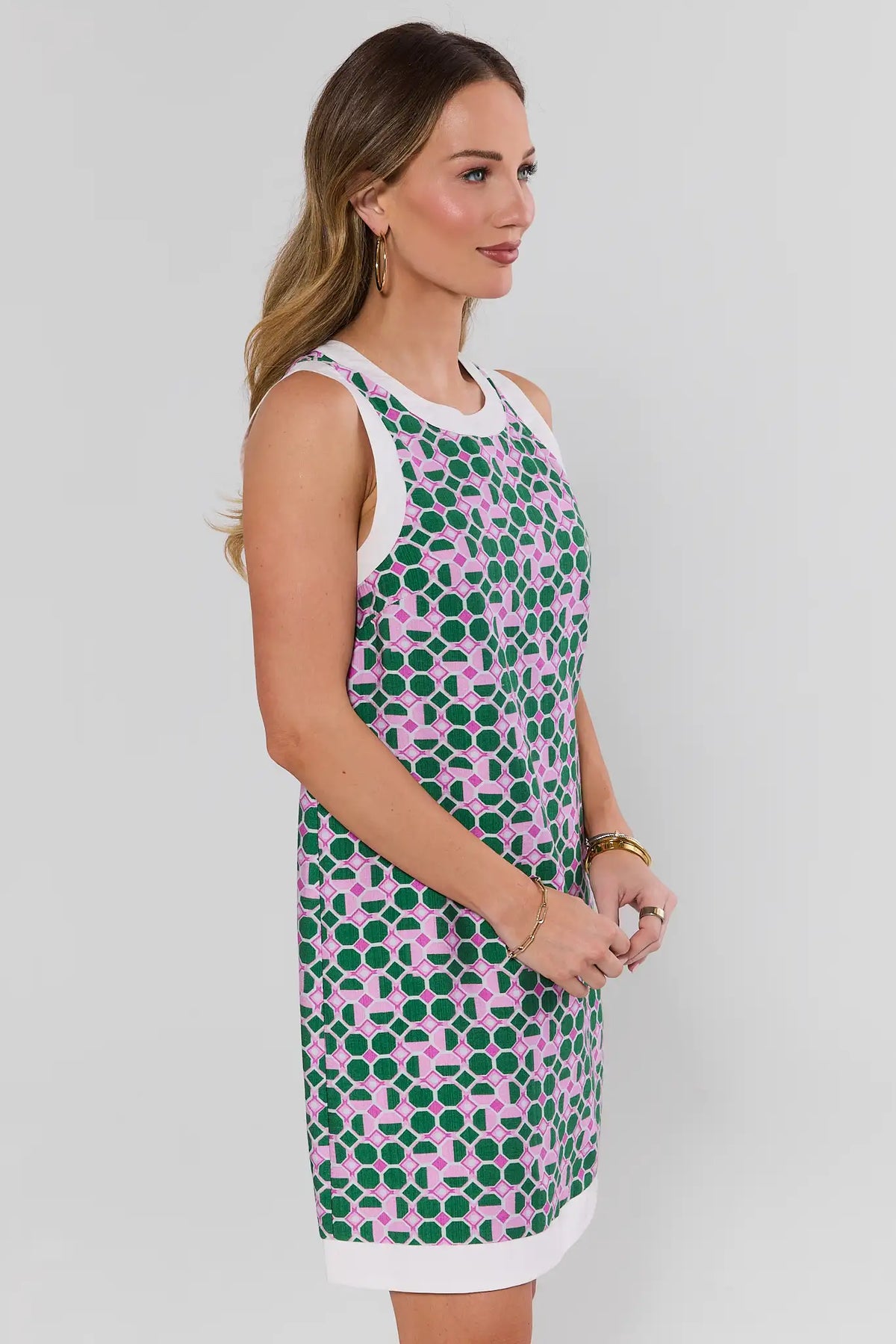 Green and pink geometric print sleeveless mini dress with white contrast trim - Side Profile | Avara