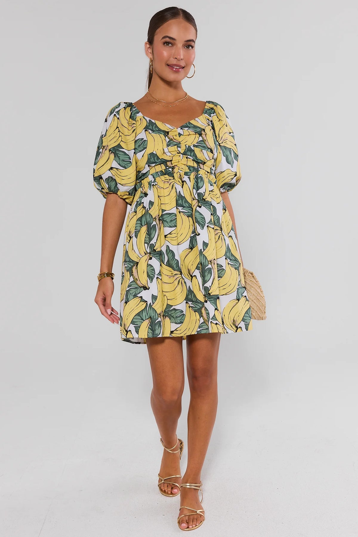 Yellow banana printed puff sleeve mini dress - Full-Length Front View styled with gold sandals | Avara