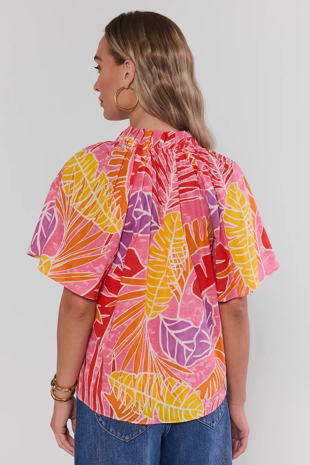Pink Palm Print Split Neck Top, back view showing flutter sleeves and gathered neckline detail | Avara