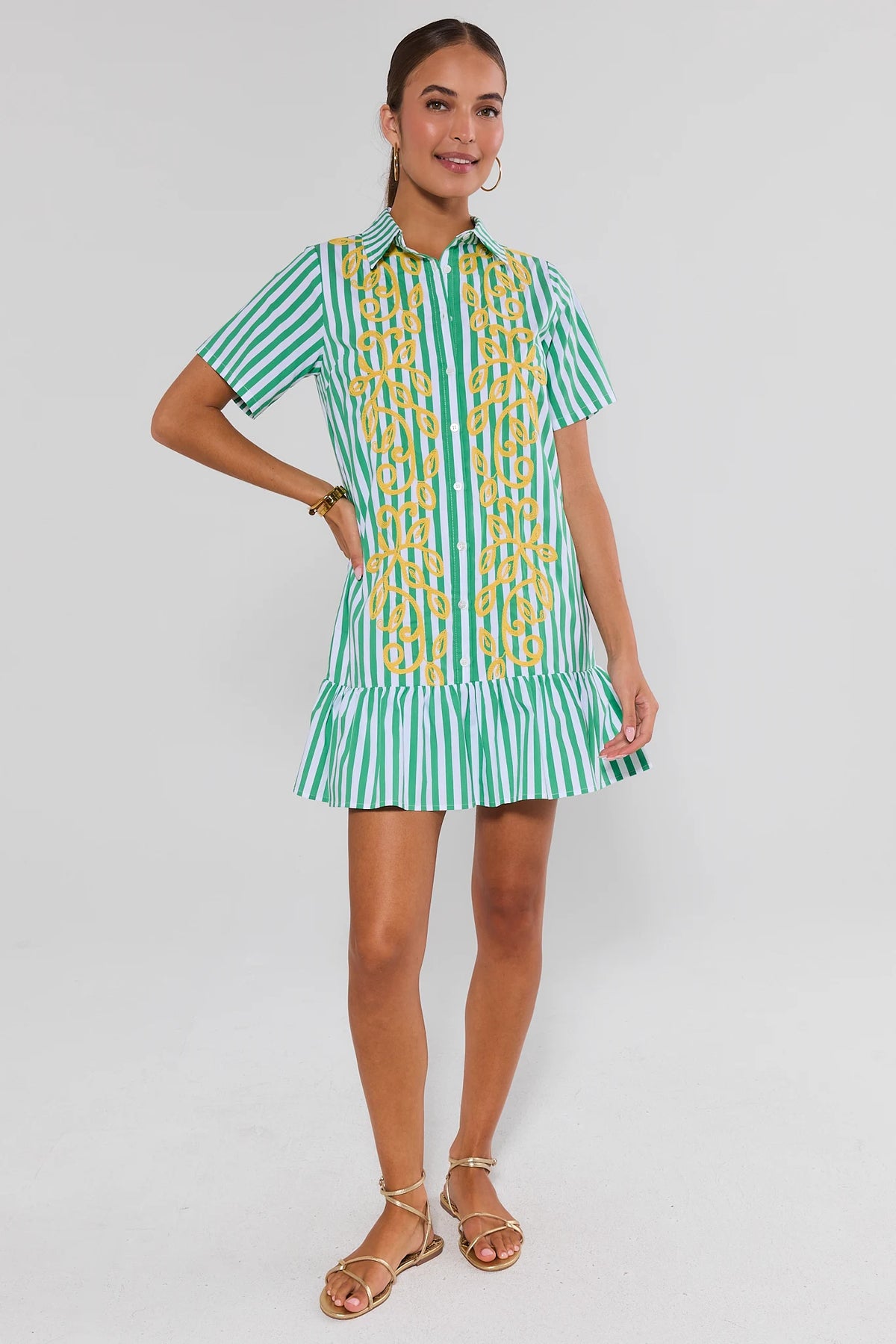 Green striped drop waist short dress with yellow embroidery, full-length front view on model with gold sandals | Avara