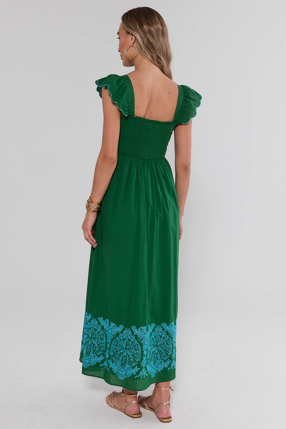Green Flutter Sleeve Maxi Dress with smocked back and turquoise embroidered hem - Back View | Avara