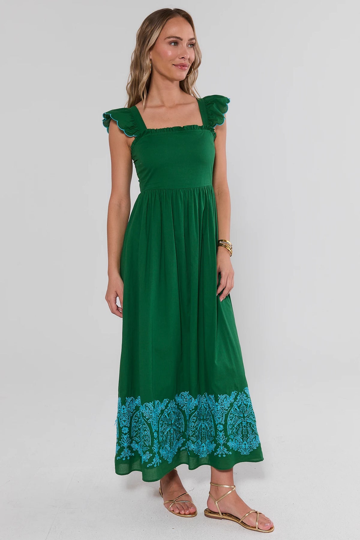 Green Flutter Sleeve Maxi Dress with blue embroidered border hem - Side View | Avara