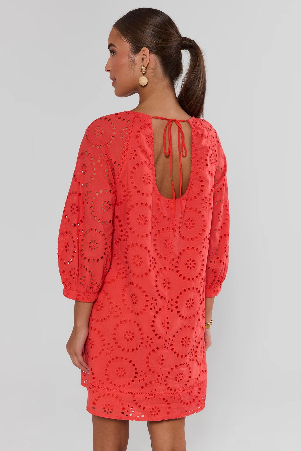 Red Eyelet Short Dress showing open V-back with tie and eyelet hem trim - Back View | Avara