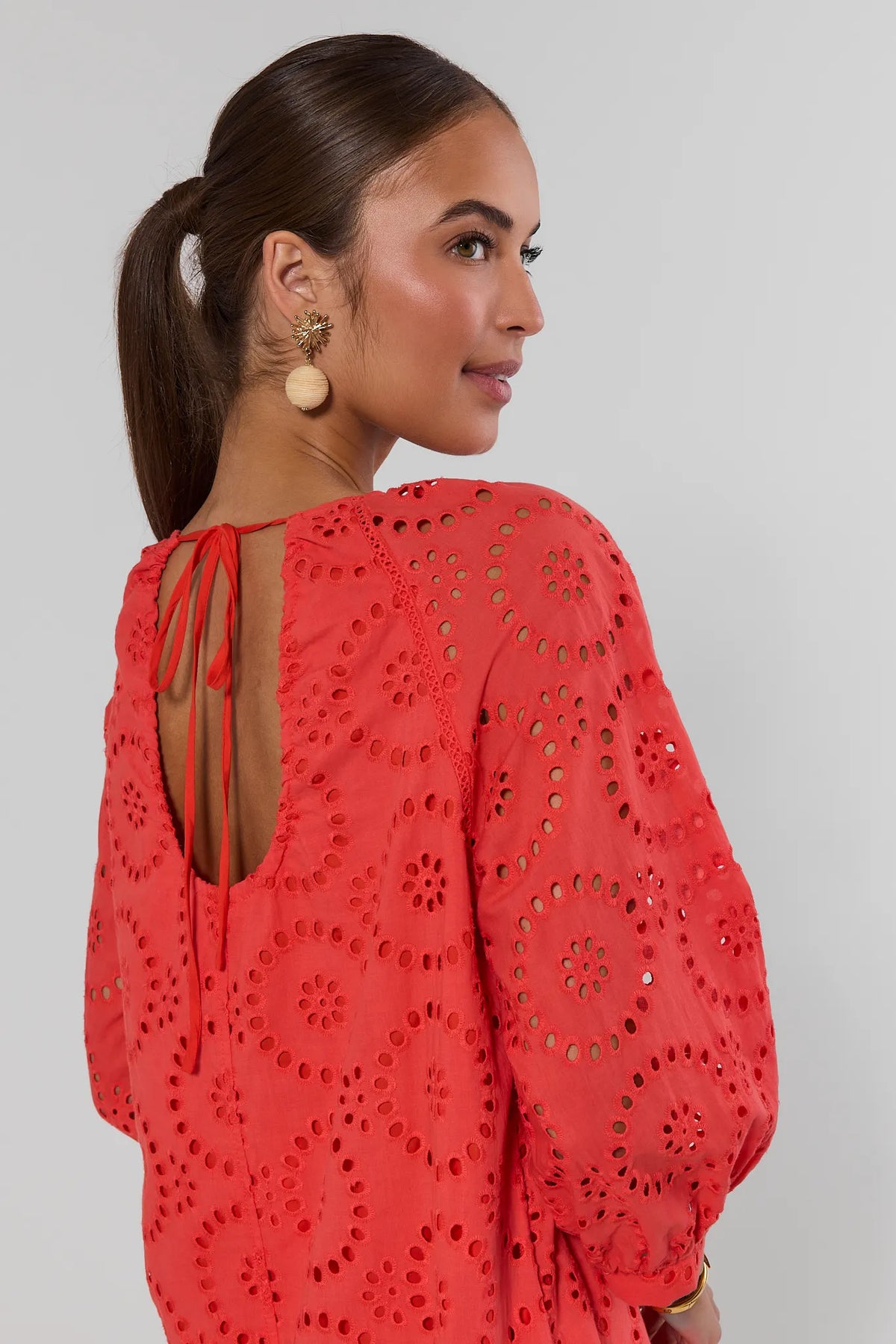 Red eyelet mini dress back tie closure detail with open V-back - Close-Up Back | Avara