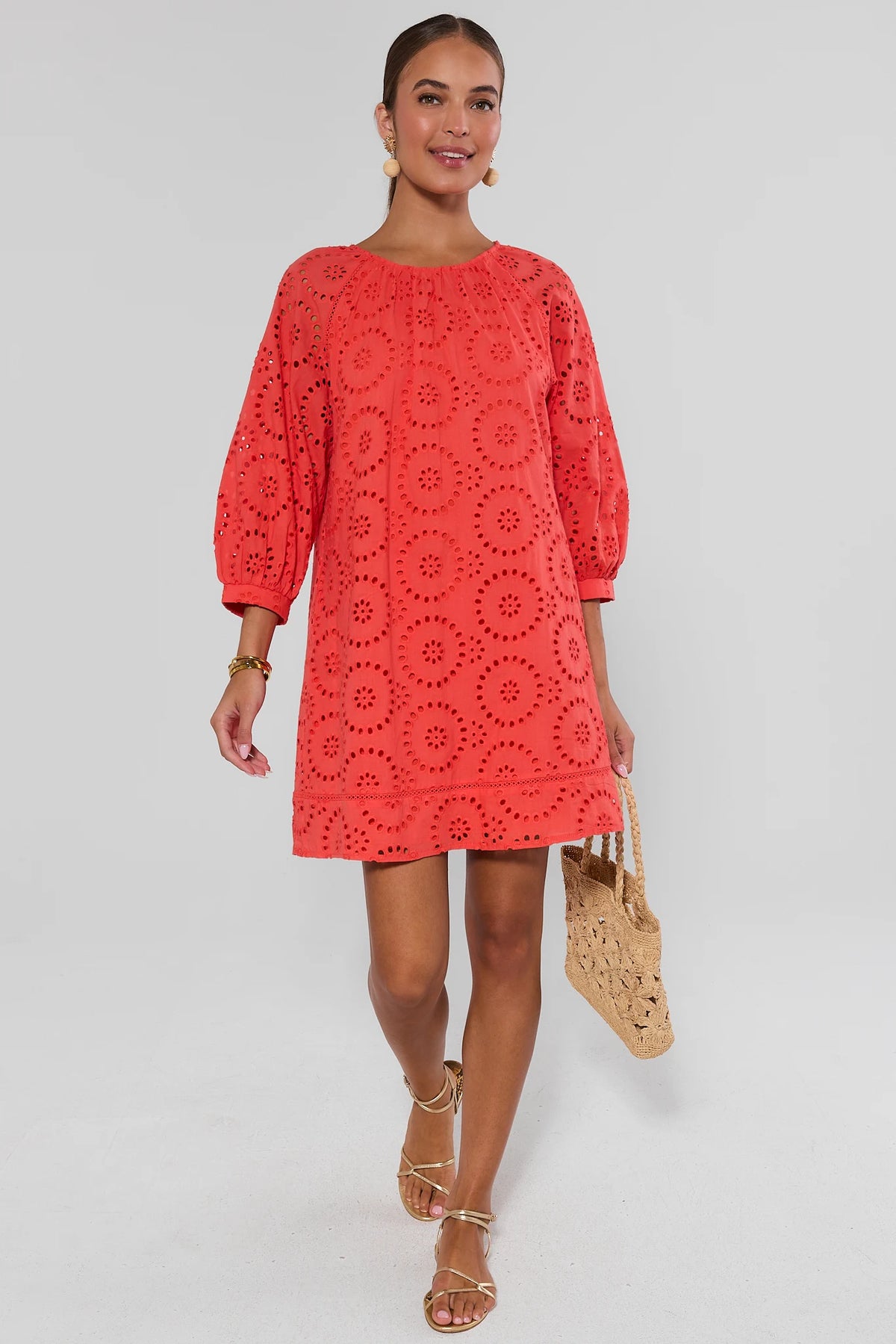 Red Eyelet Short Dress styled with gold sandals and woven bag - Full Length On Model | Avara